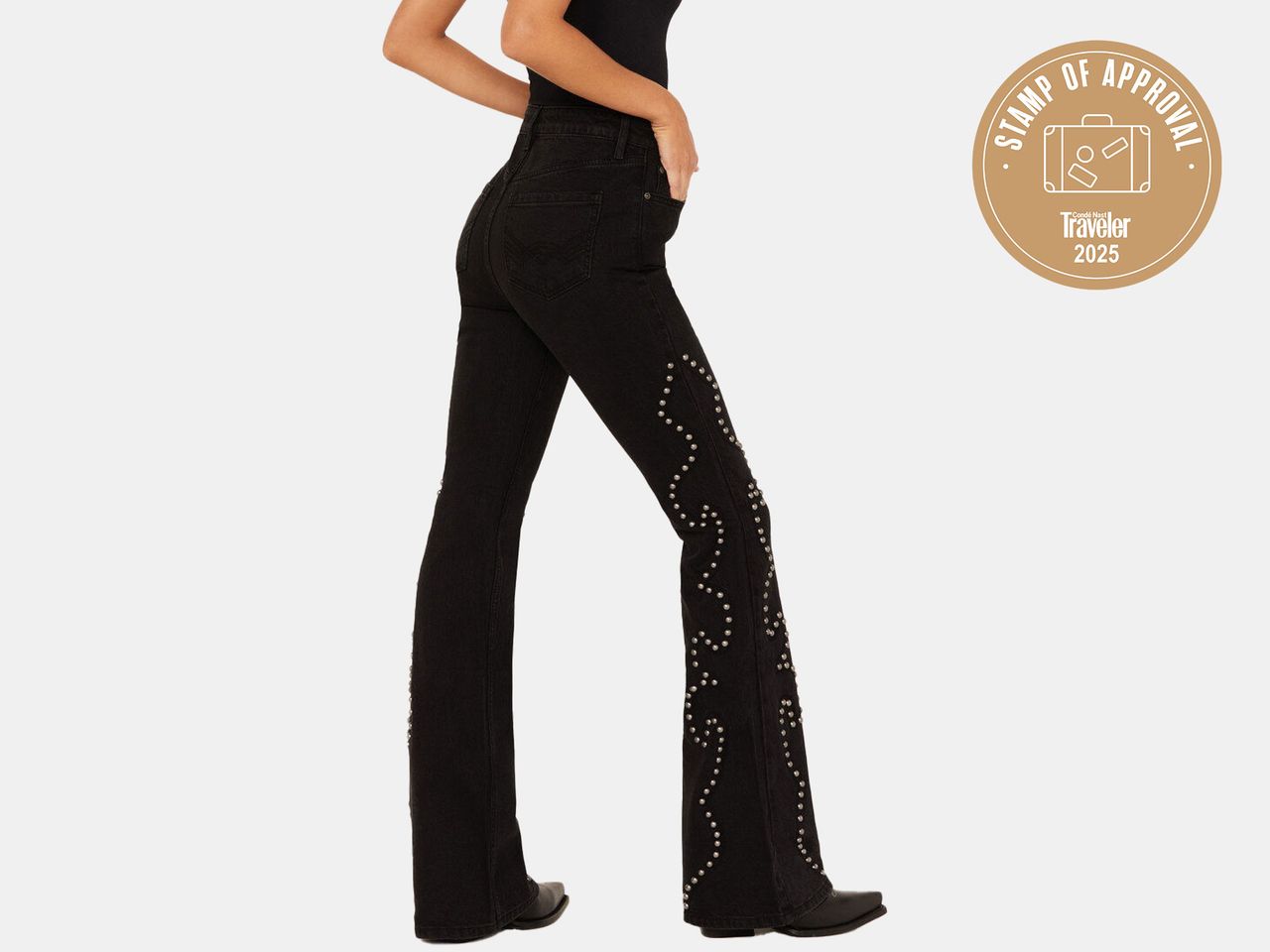 model in dark jeans with detail on sides
