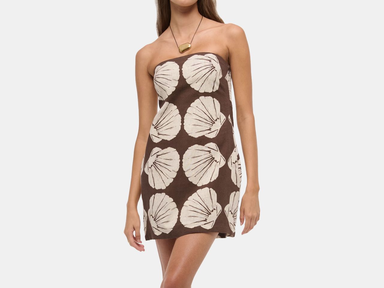 model in brown and cream, shell patterned dress