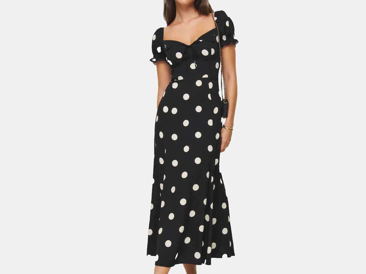Image may contain: Pattern, Clothing, Dress, Adult, Person, Accessories, Bracelet, Jewelry, and Polka Dot