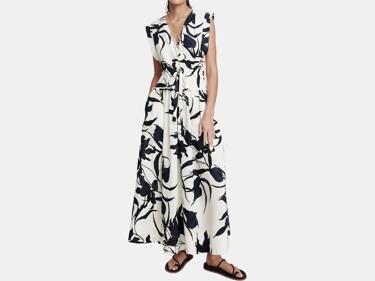 model in white and blue floral dress