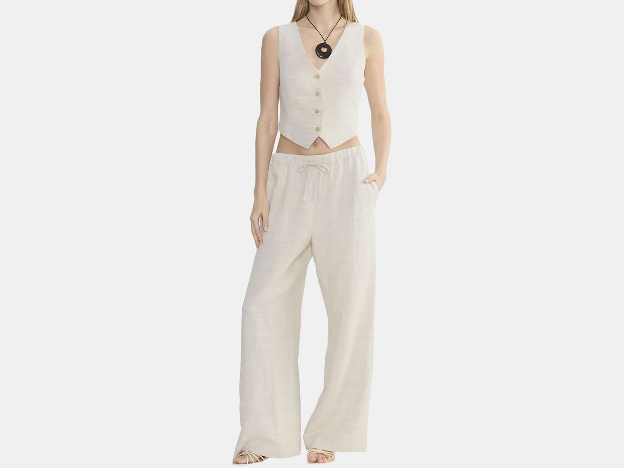 model in two piece ecru top and bottom