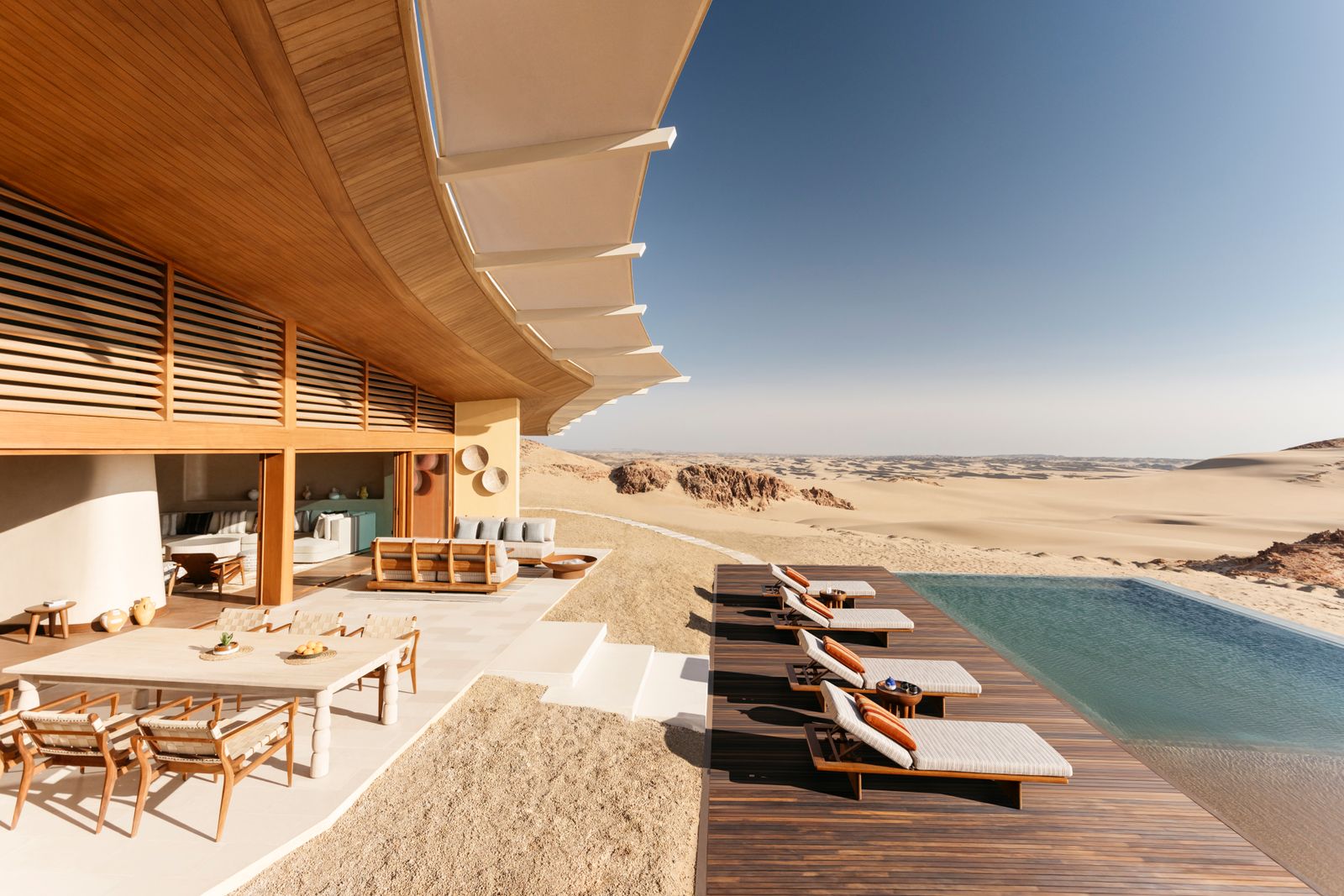 Image may contain Indoors Interior Design Terrace Architecture Building Hotel Resort House Housing Villa and Chair