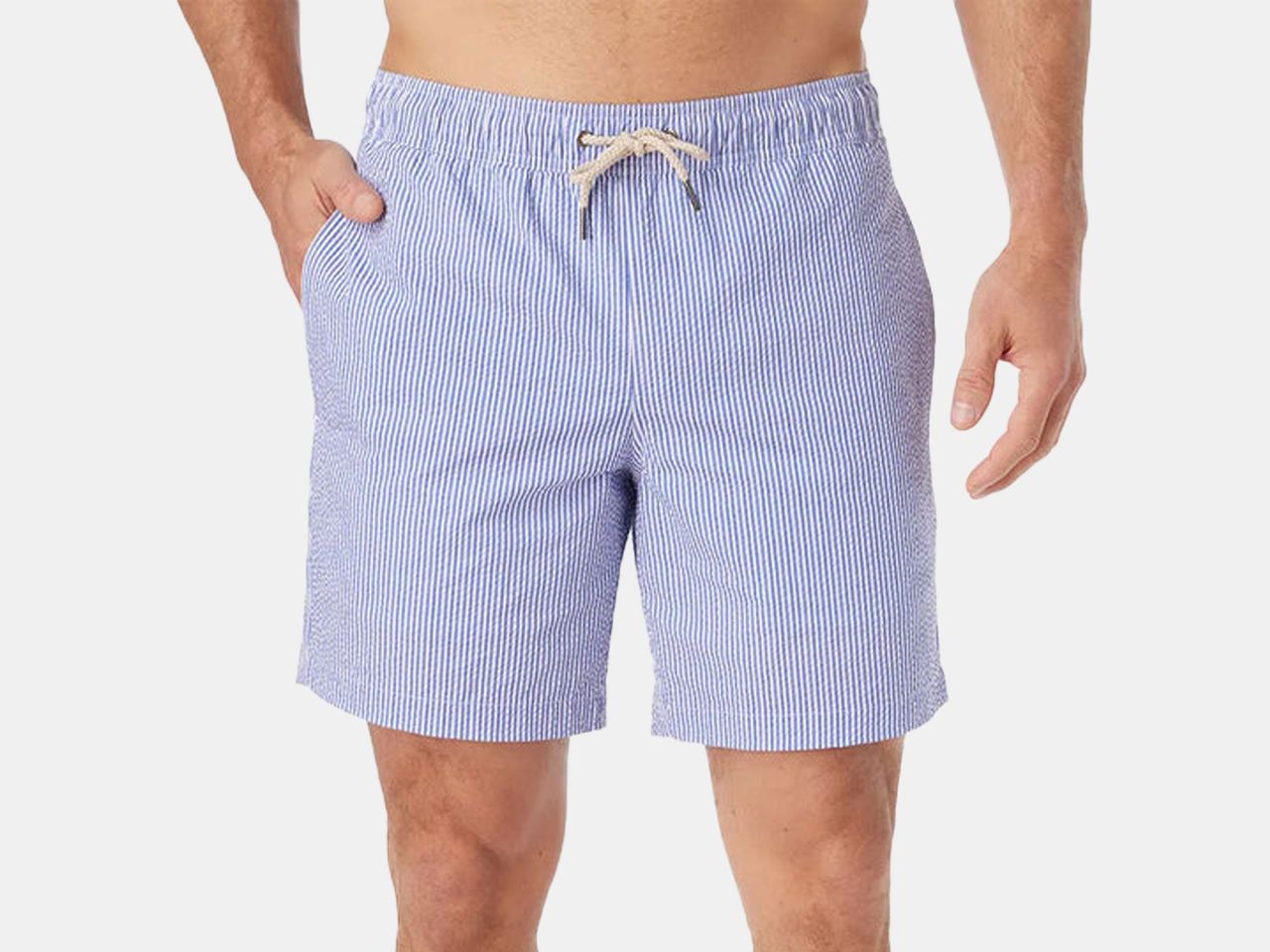 model in blue pin strip swim trunks