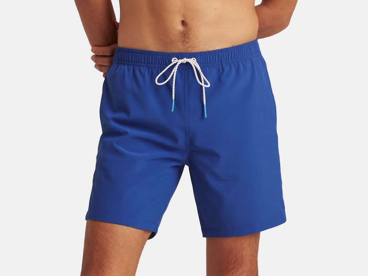 model in blue swim trunks
