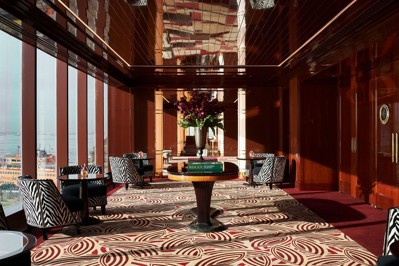 Image may contain: Lobby, Room, Indoors, Flooring, Furniture, Rug, Home Decor, Floor, Living Room, and Interior Design
