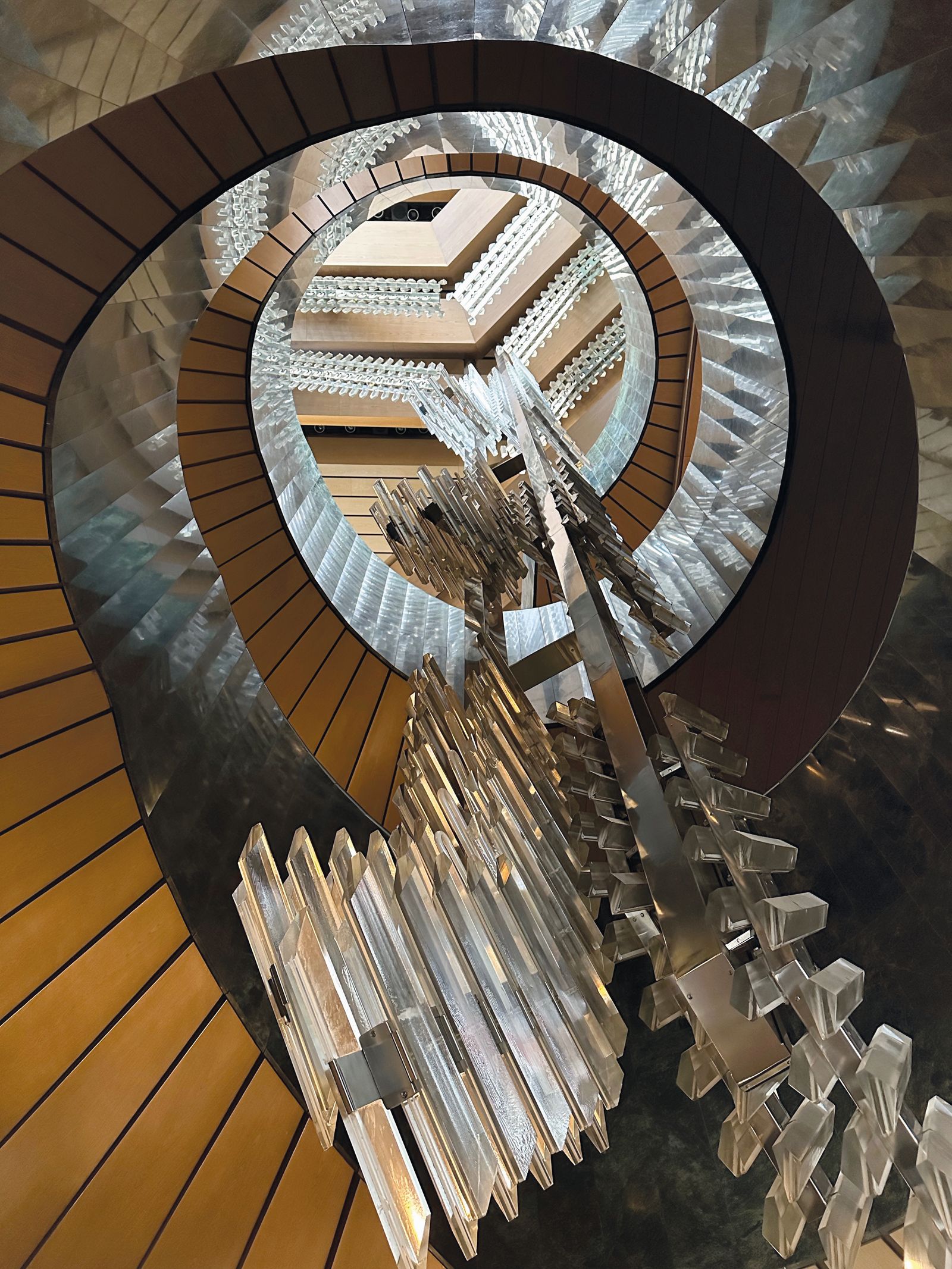 Image may contain Indoors Interior Design Architecture Building House Housing Staircase Chandelier Lamp and Foyer