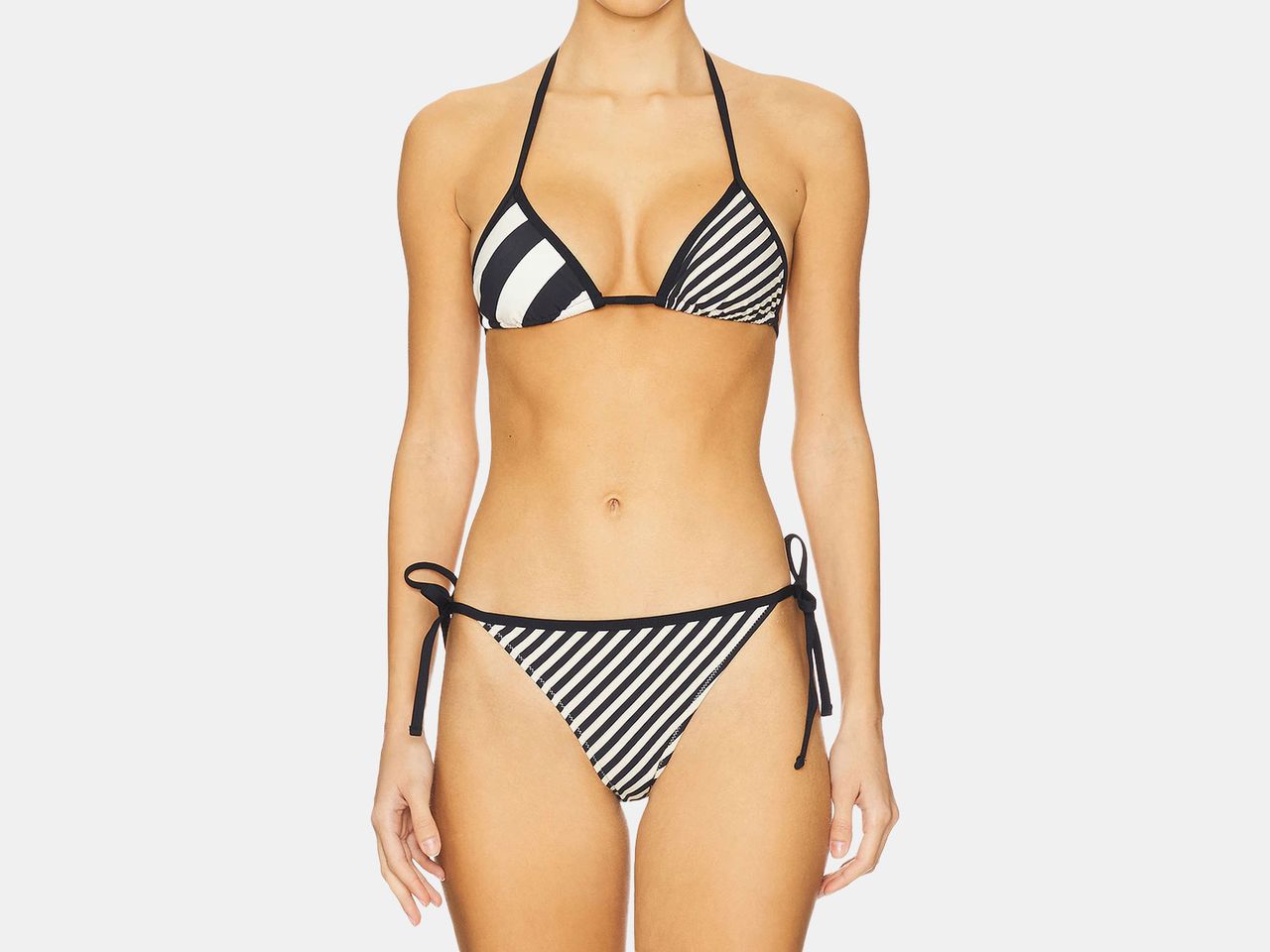 model wearing black and white striped bikini