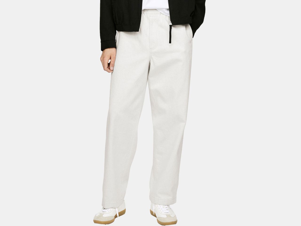 model in off white pants