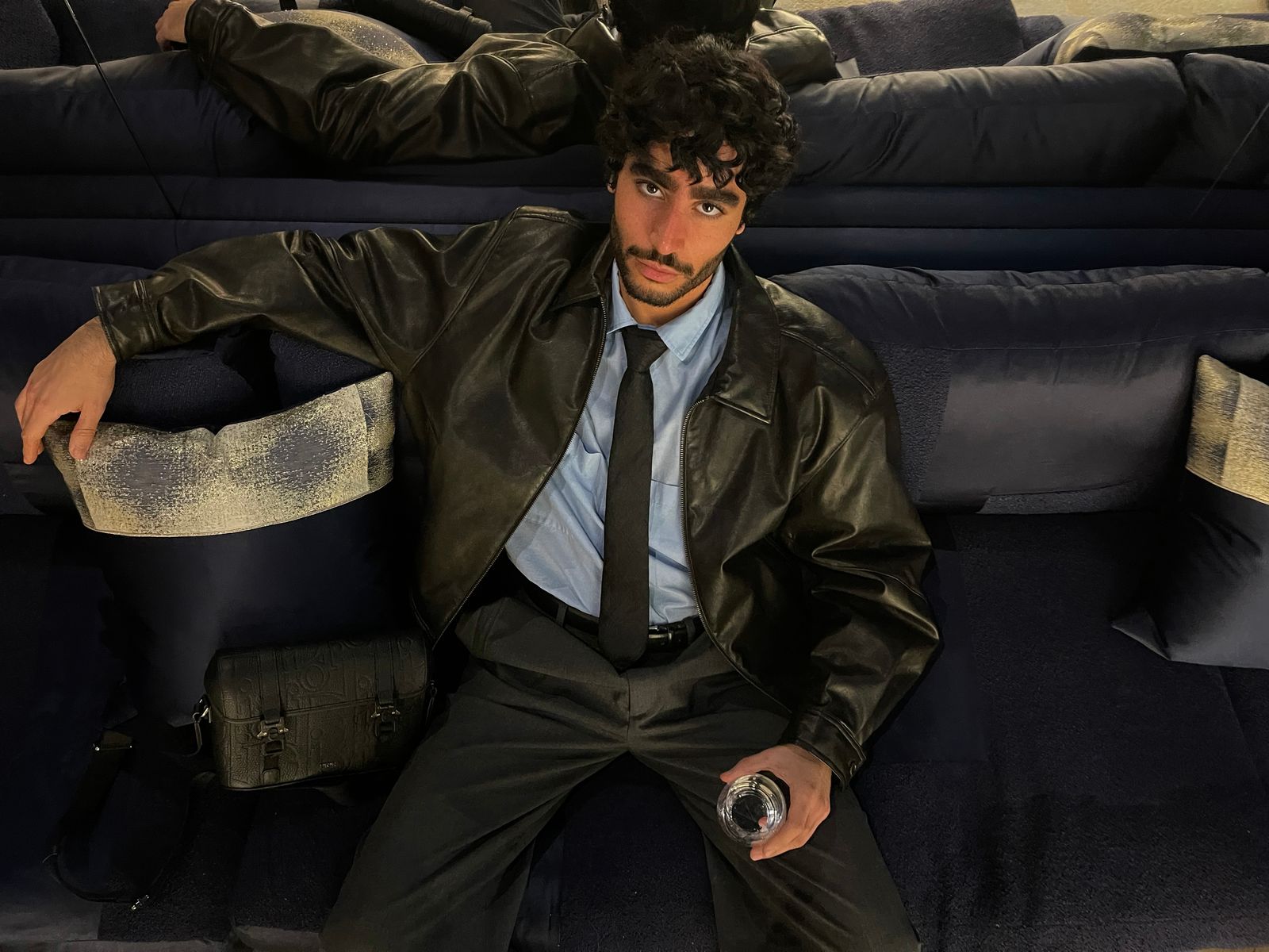 Image may contain Stephen Mangan Accessories Formal Wear Tie Clothing Coat Jacket Adult Person Bag and Handbag
