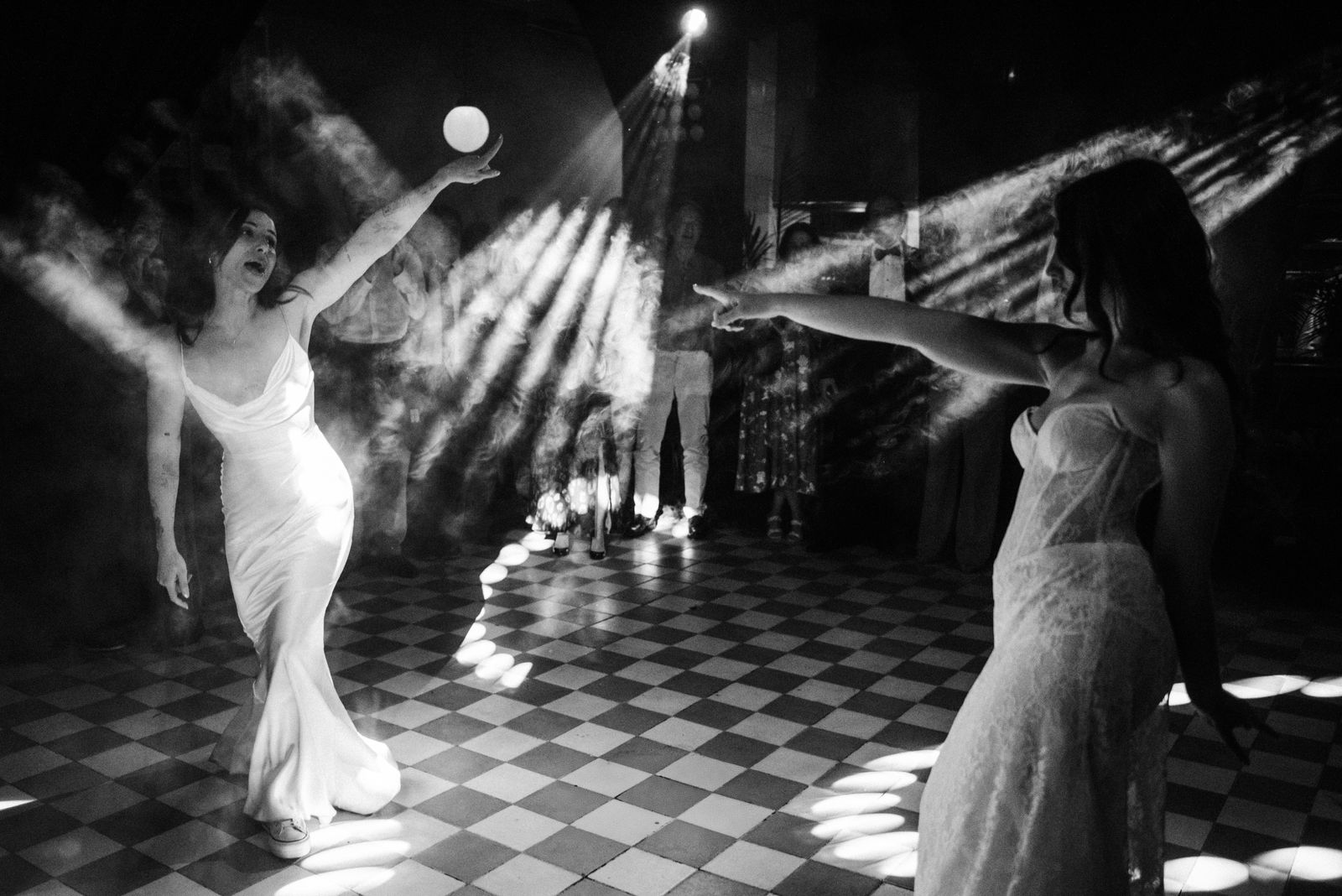 Image may contain Lighting Clothing Dress Dancing Leisure Activities Person Adult Formal Wear Wedding and Urban