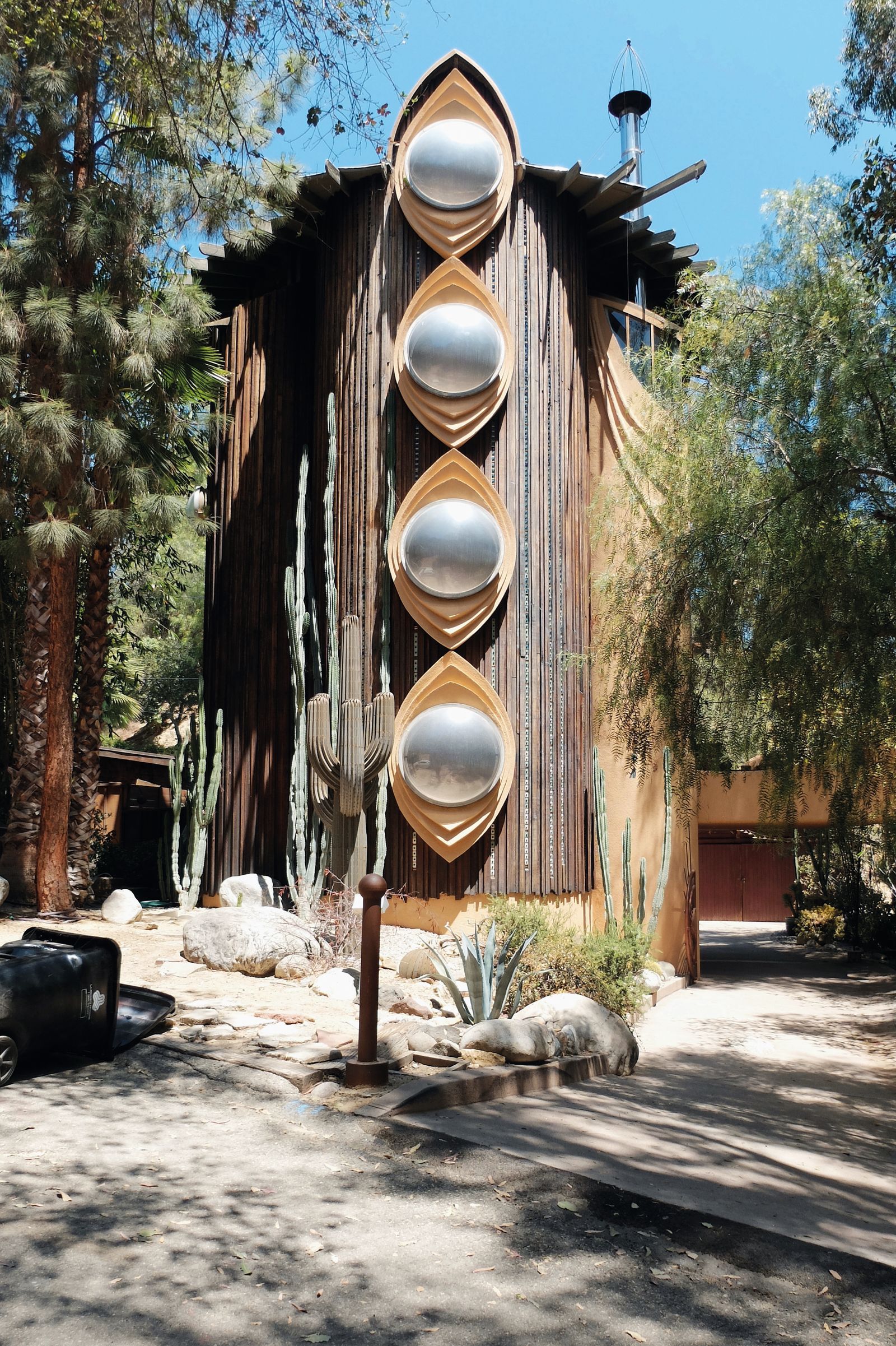 Image may contain Architecture Building Outdoors Shelter Wood Plant Tree Vegetation Housing Car and Transportation