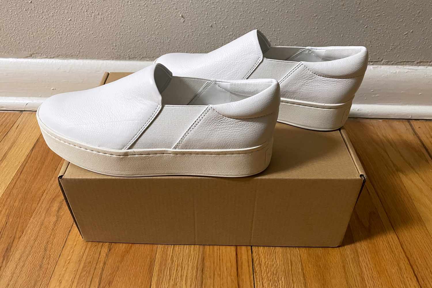 Vince Warren Suede Slip On Platform Sneakers sitting on a box