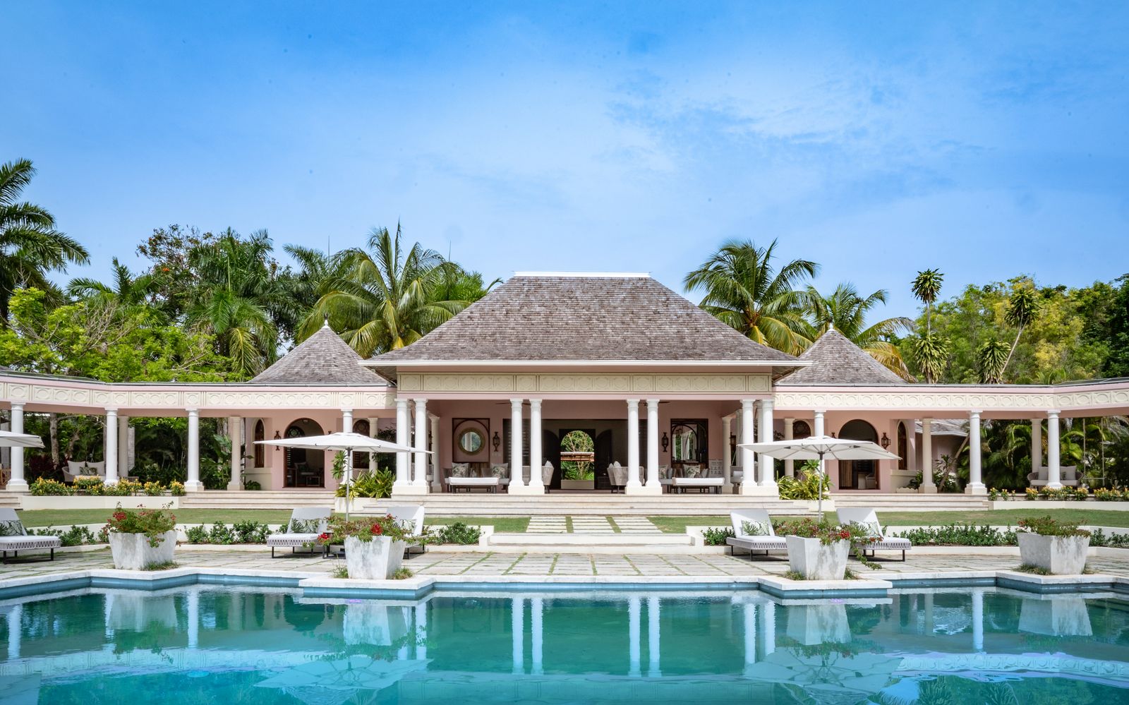 Image may contain Architecture Building House Housing Villa Hotel Resort Chair Furniture Pool Water and Plant