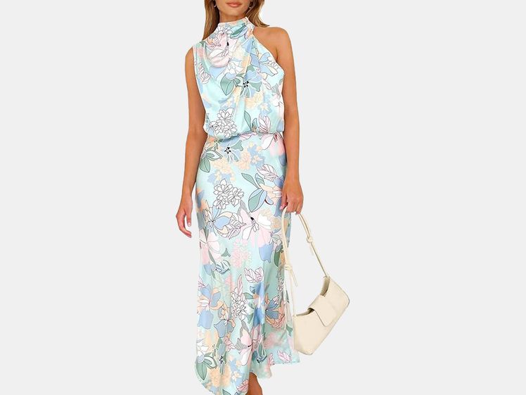 model in blue floral graphic dress