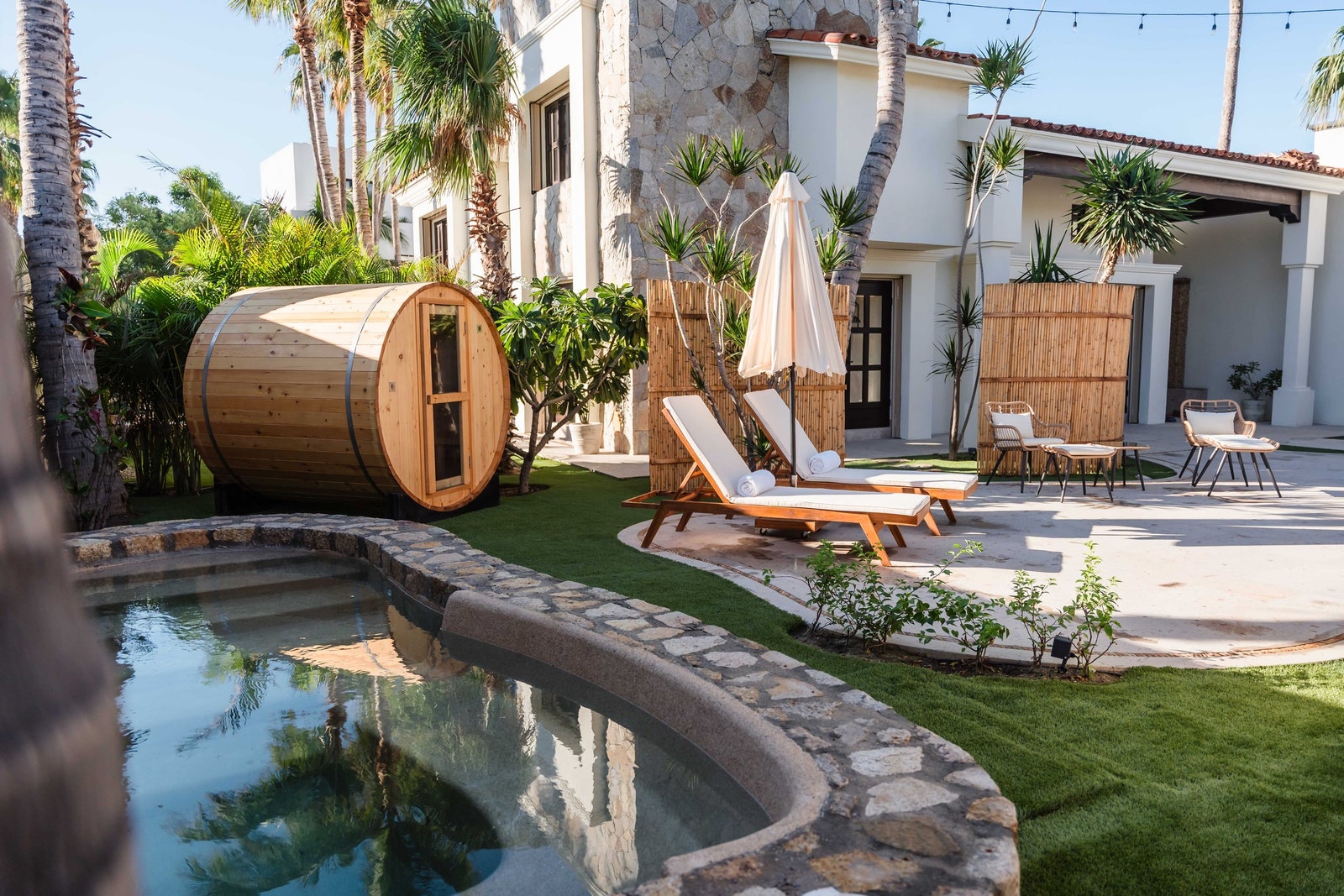 Image may contain Backyard Nature Outdoors Yard Architecture Building House Housing Villa Chair and Furniture