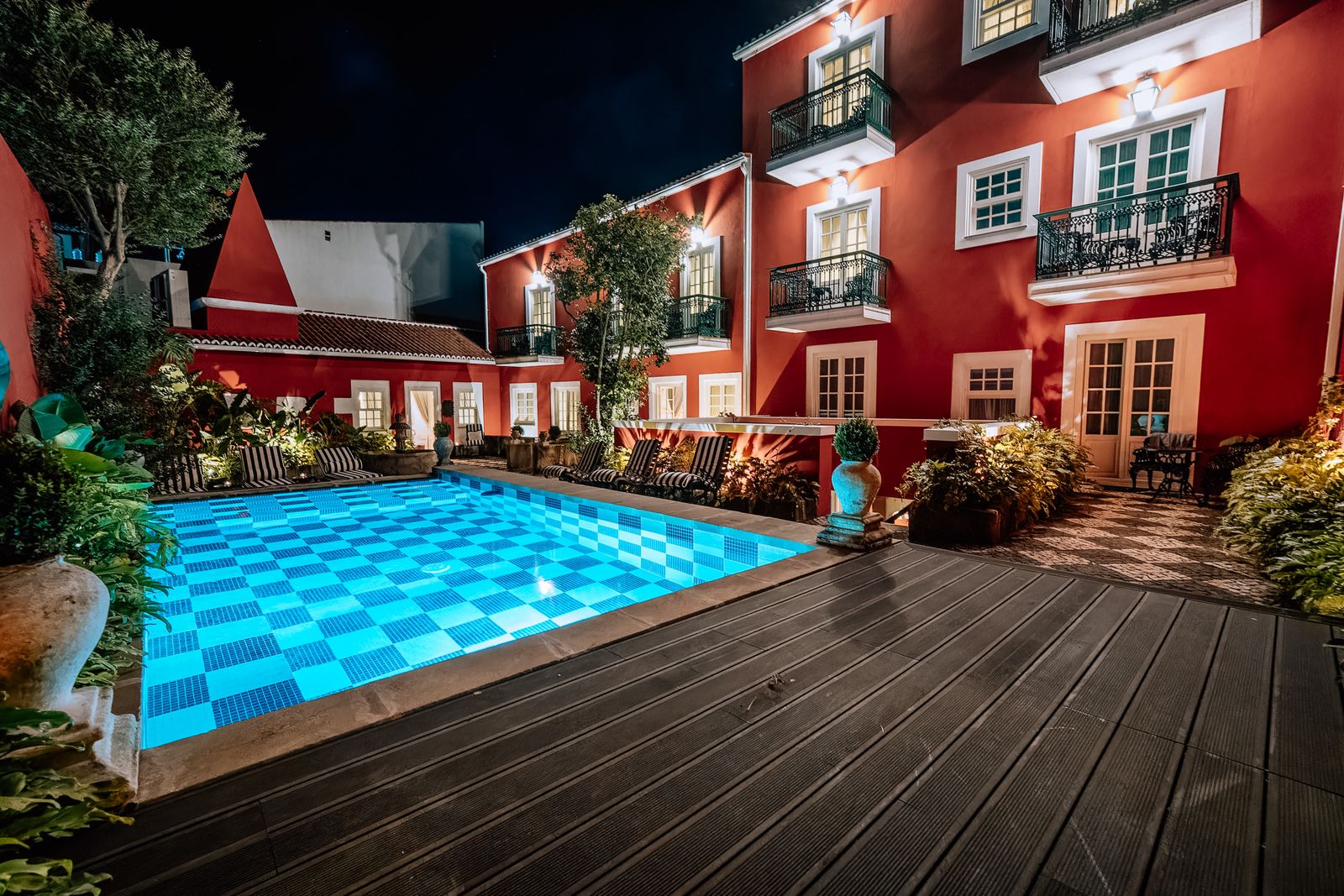 Image may contain Pool Water Swimming Pool Architecture Building House Housing Villa Outdoors and Plant