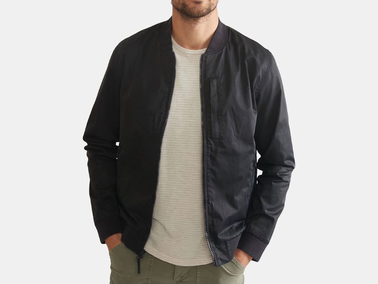 model in blue black bomber jacket