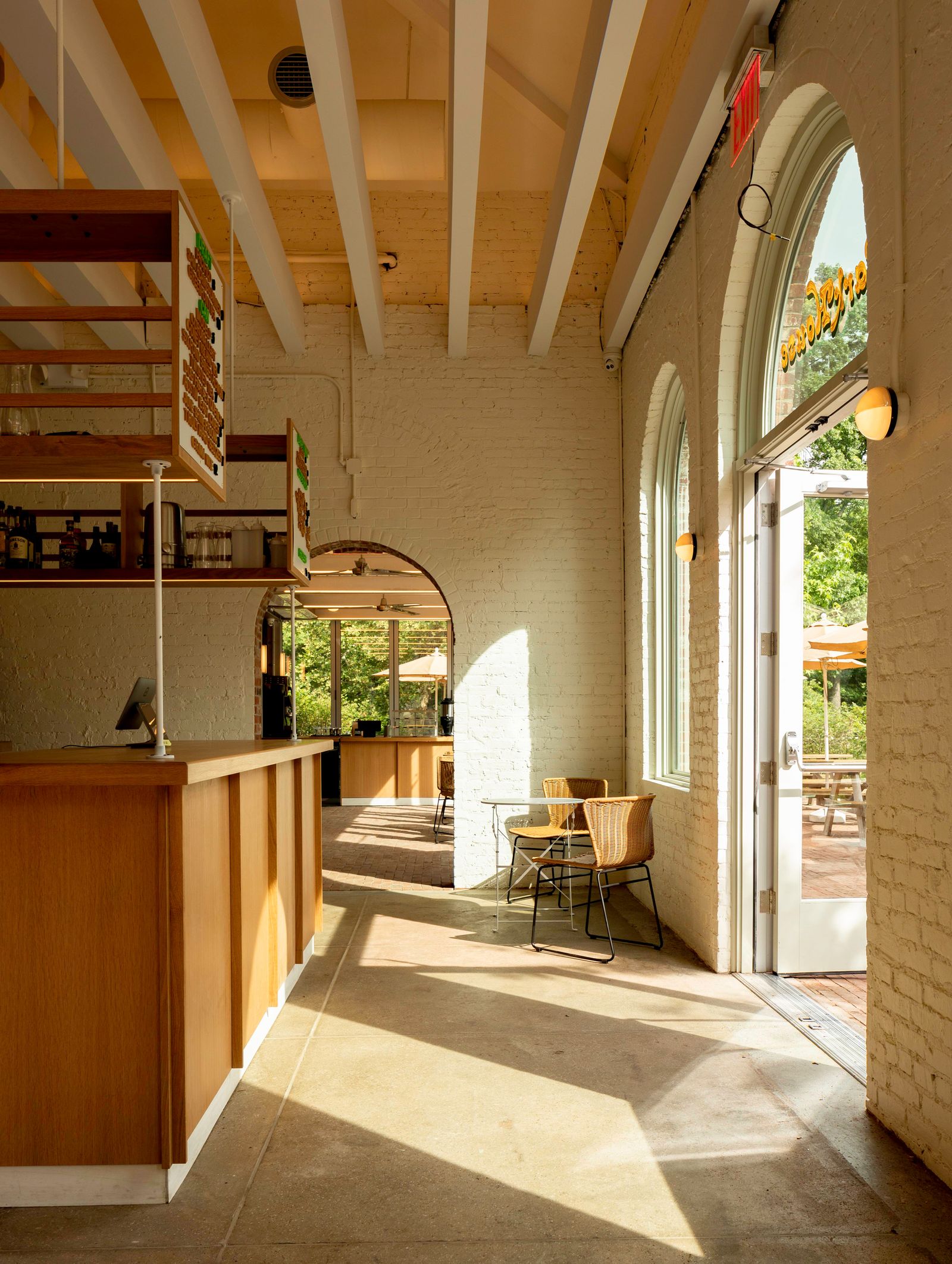 Image may contain Floor Indoors Interior Design Flooring Chair Furniture Lamp Wood Desk Table and Architecture