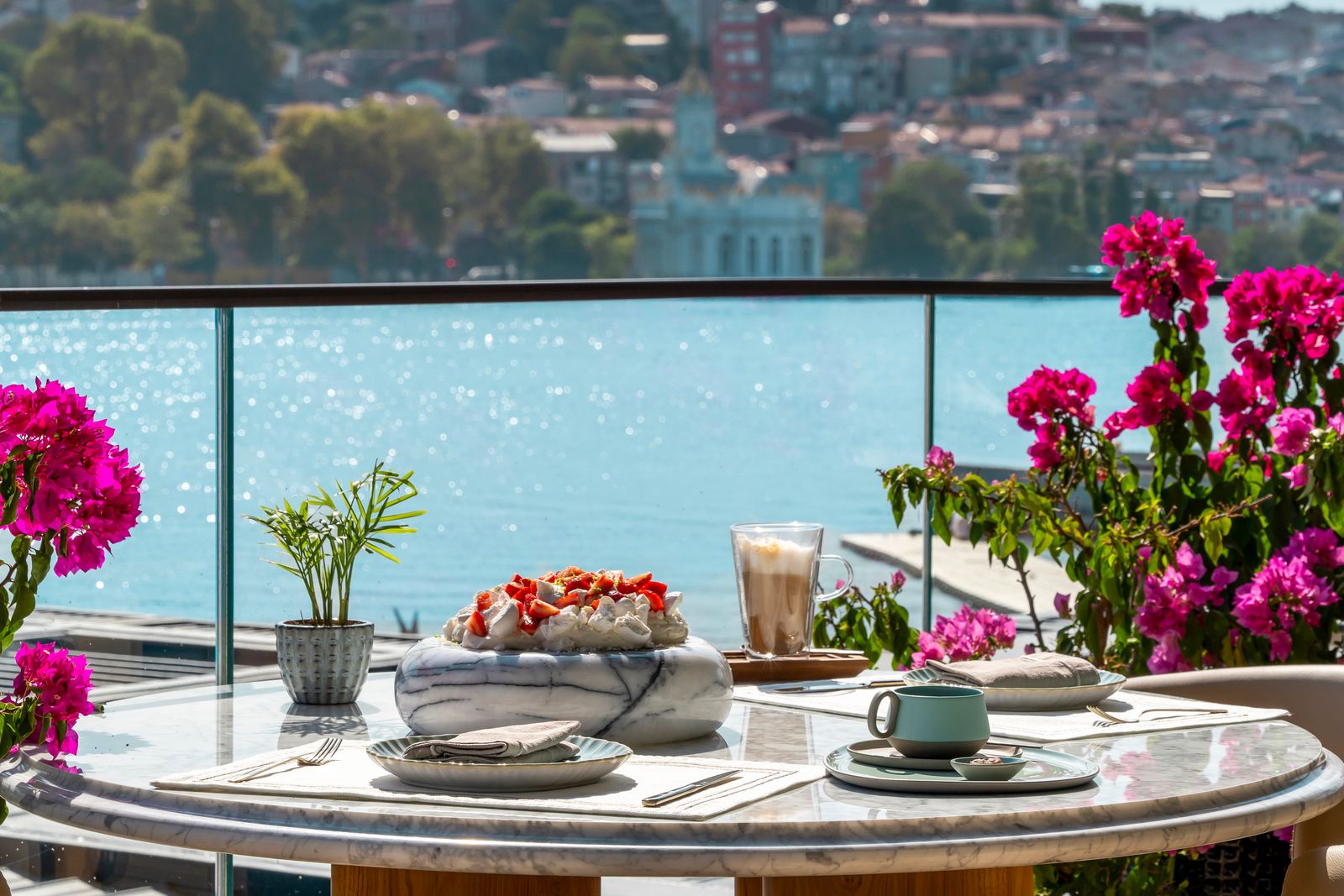 Image may contain Nature Outdoors Scenery Plant Cup Plate Chair Furniture Architecture Balcony and Building