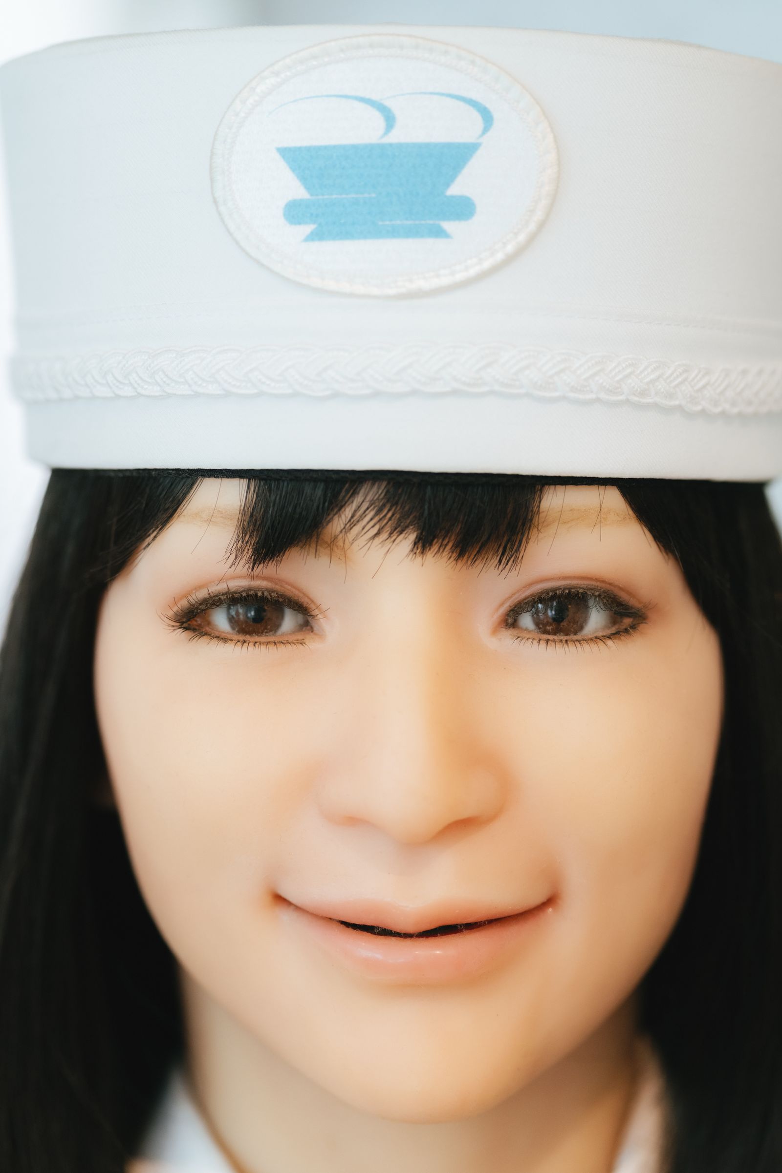 Image may contain Clothing Hat Cap Person Face Head Photography Portrait Happy Smile and Accessories