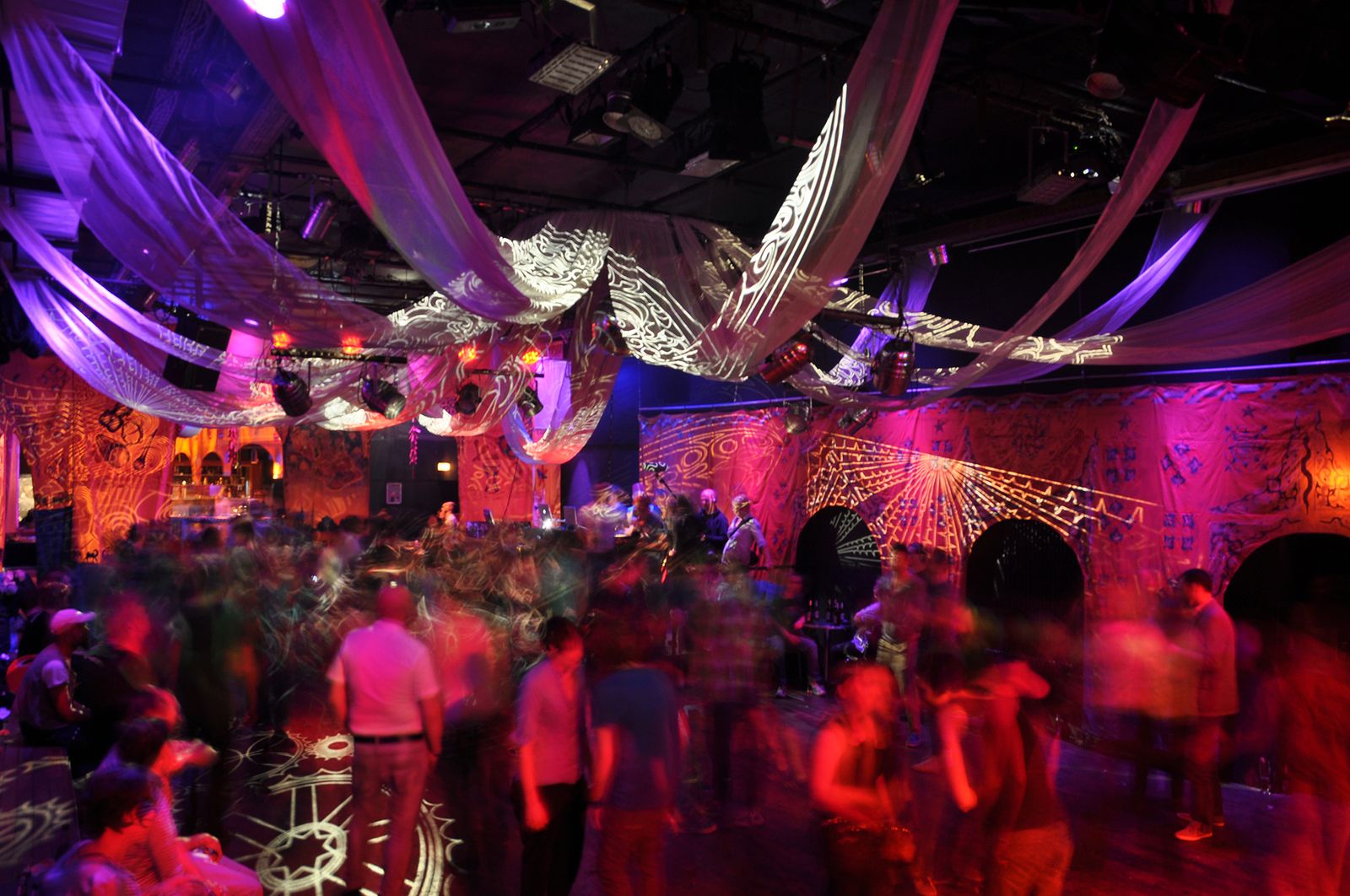 People shown a colorful night club
