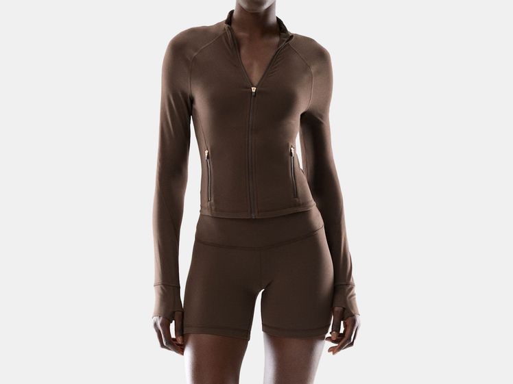 model in brown track jacket