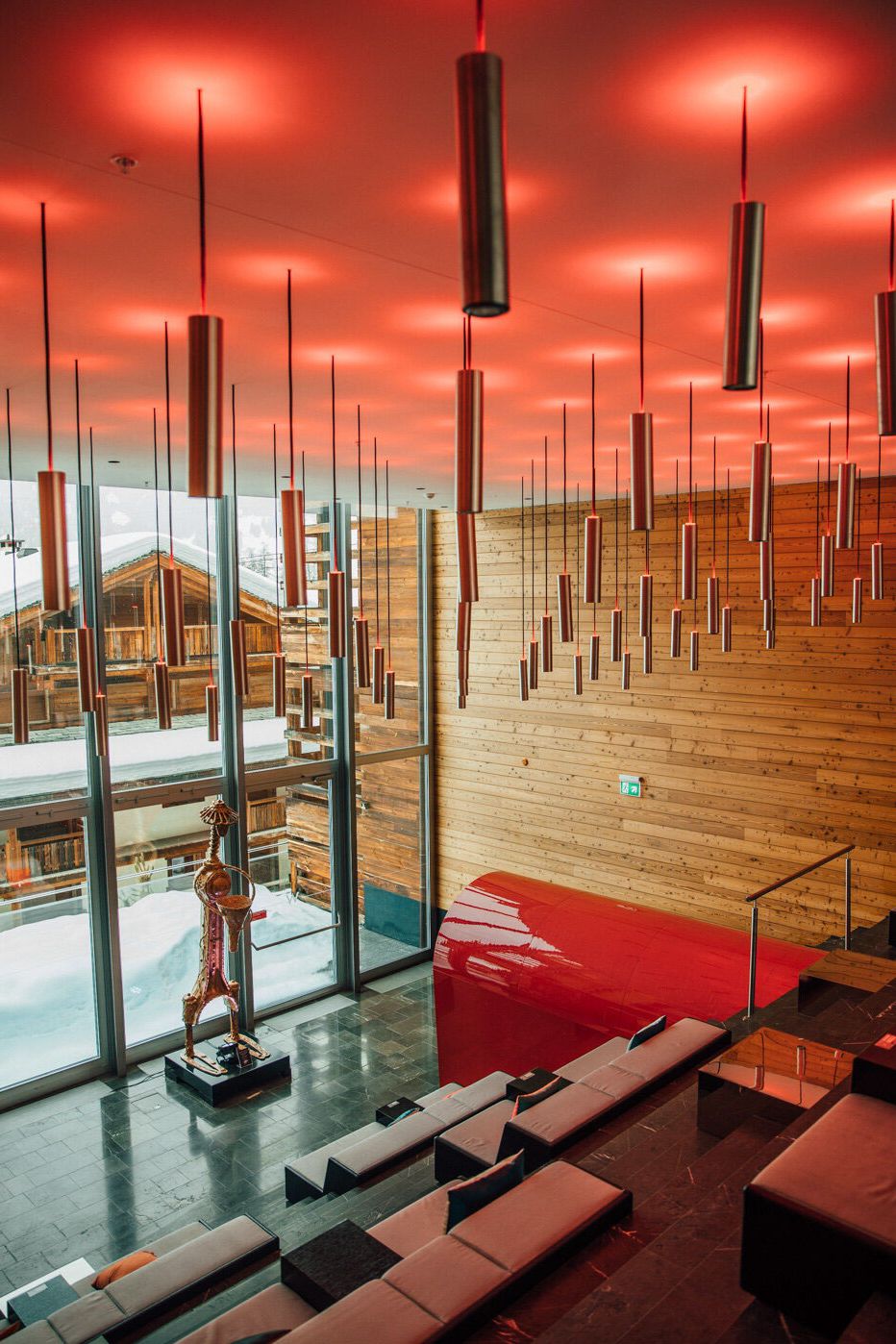 Image may contain Indoors Interior Design Lamp Architecture Building Foyer Furniture and Lounge