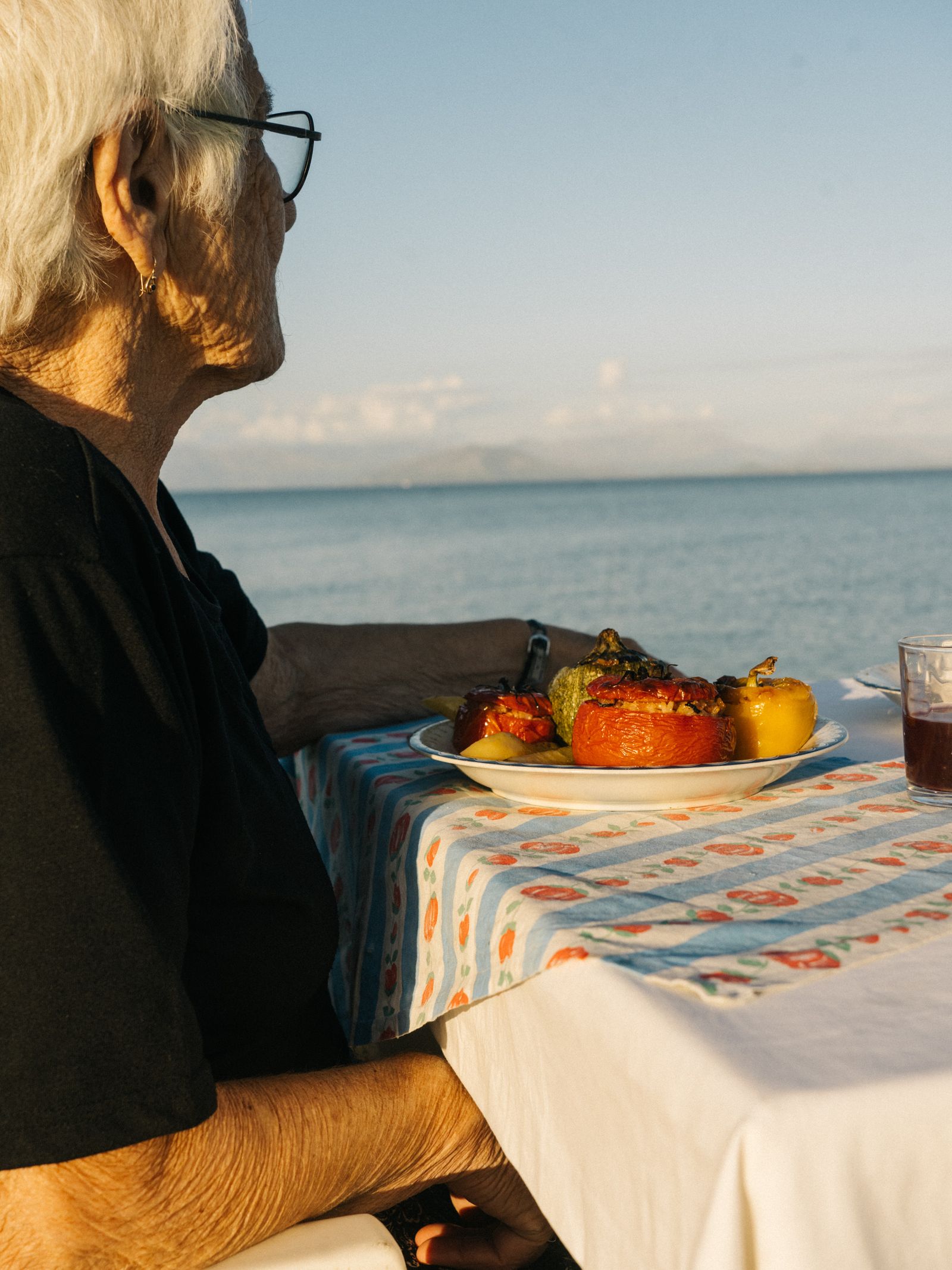 Image may contain Cup Dining Table Furniture Table Plate Adult Person Tablecloth Accessories Glasses and Brunch
