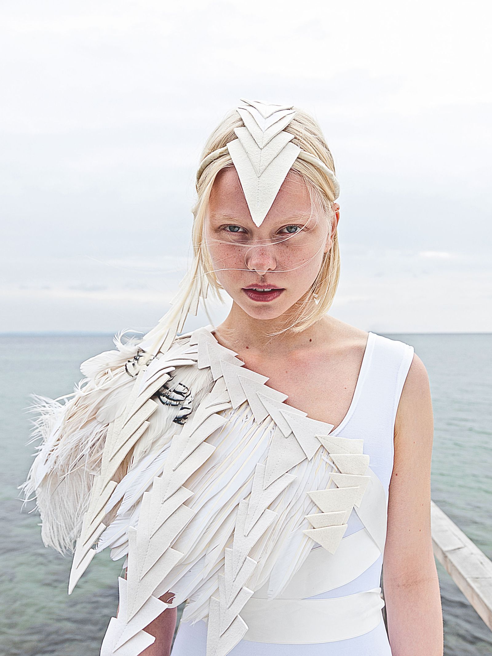 Image may contain Blonde Hair Person Clothing Costume Adult Face Head Photography Portrait Beachwear and Swimwear