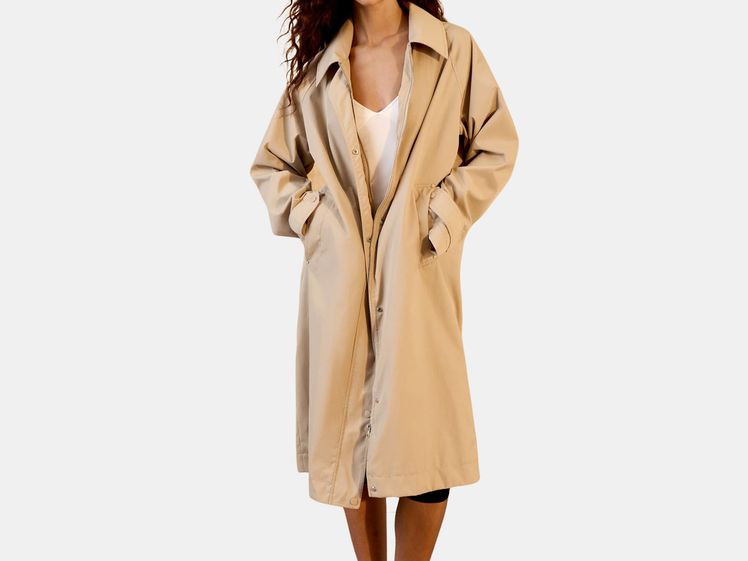 model wearing long trench coat