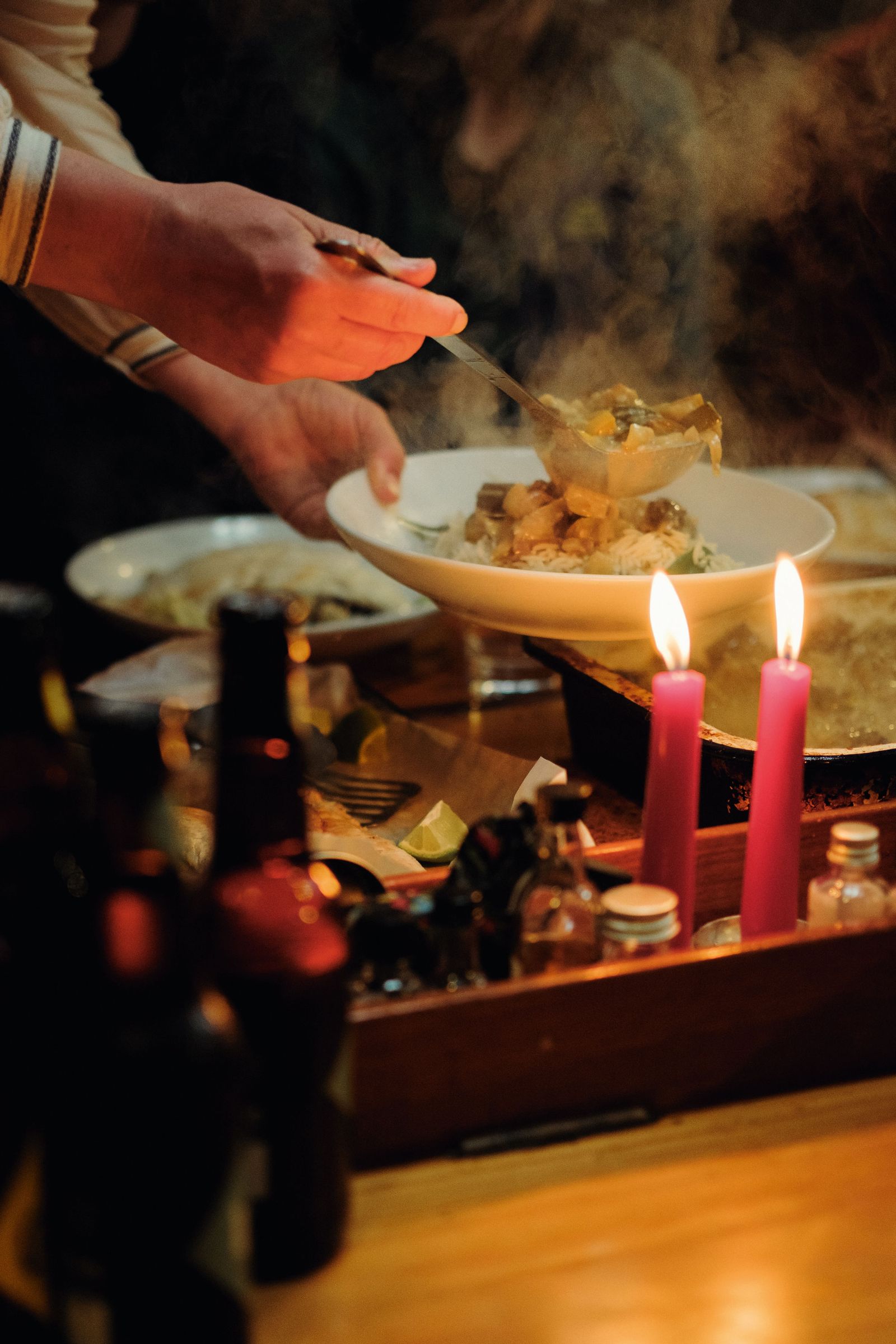 Image may contain Dining Table Furniture Table Food Meal Candle Plate Body Part Finger Hand Person and Adult