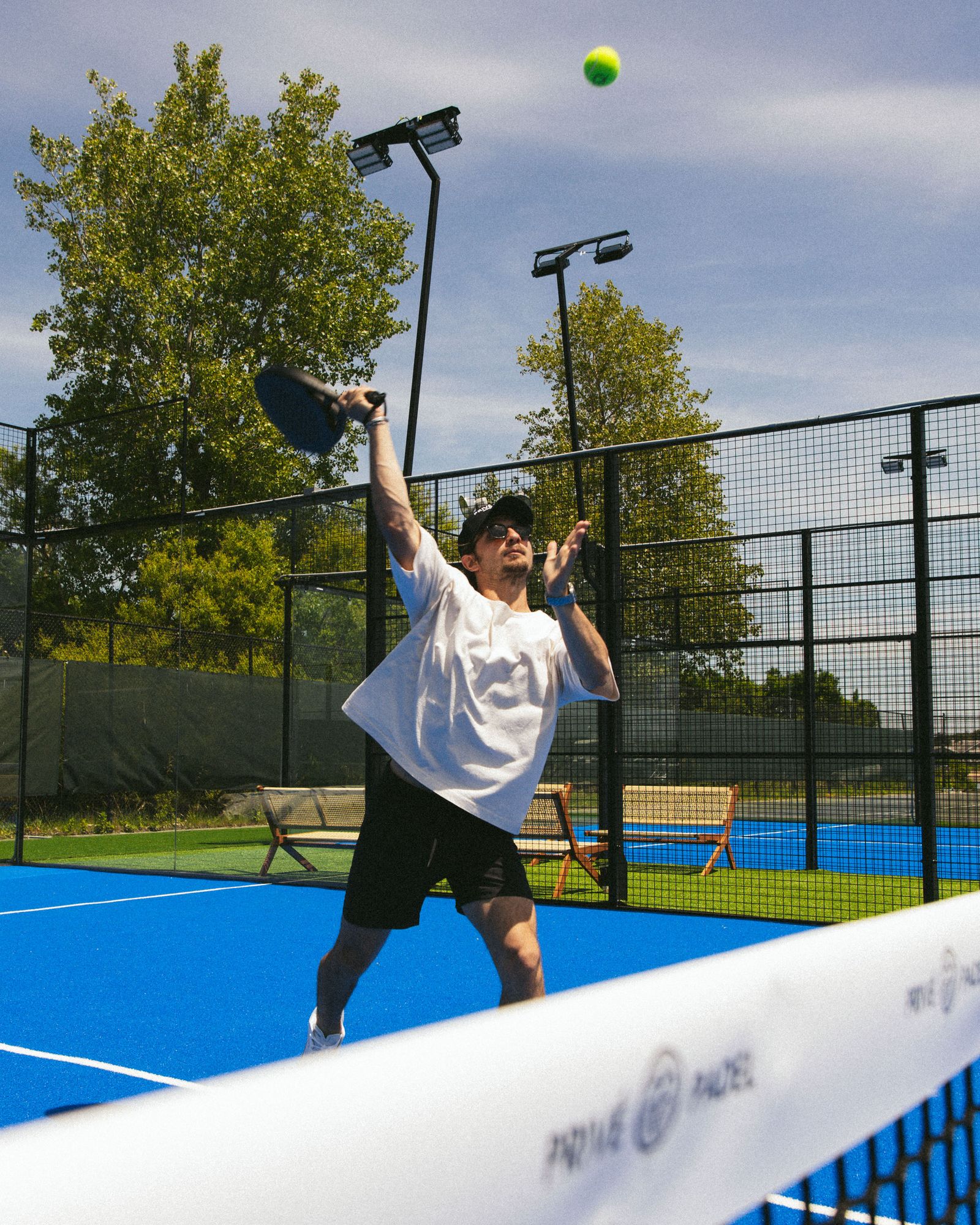 A person playing padel at Montauk Yacht Club's Priv Padel