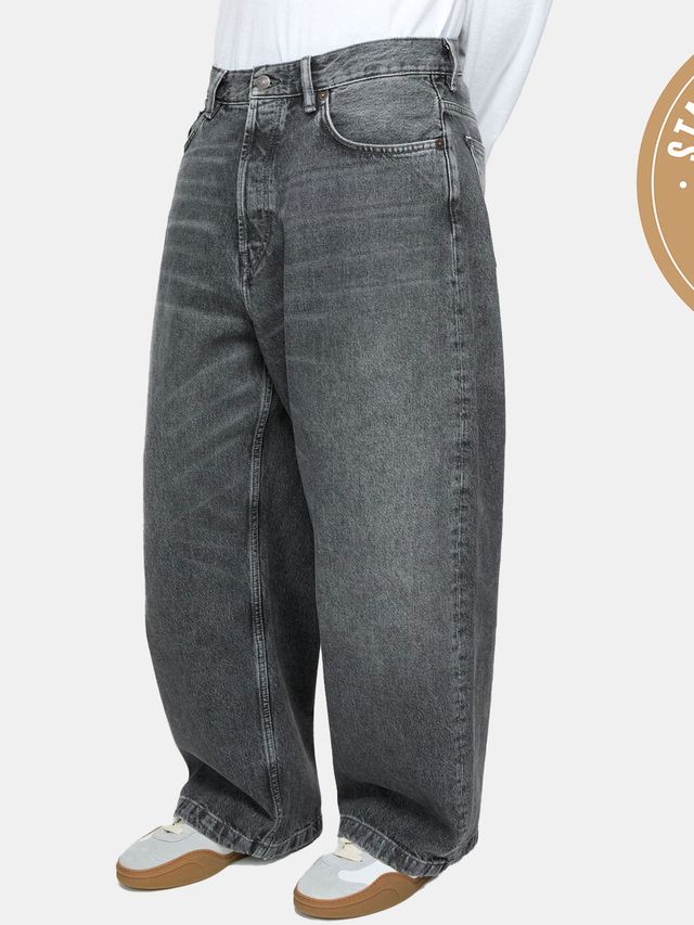 man wearing grey washed jeans