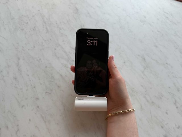 iWalk portable charger plugged into an iPhone