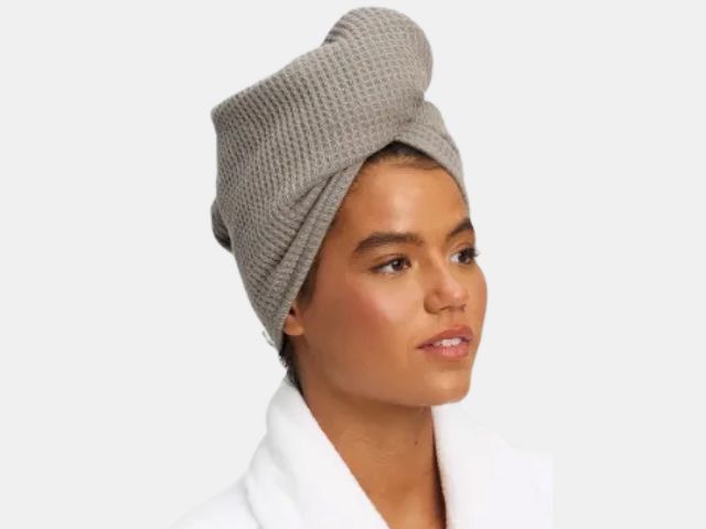 Image may contain: Clothing, Hat, Cap, Adult, Person, and Beanie