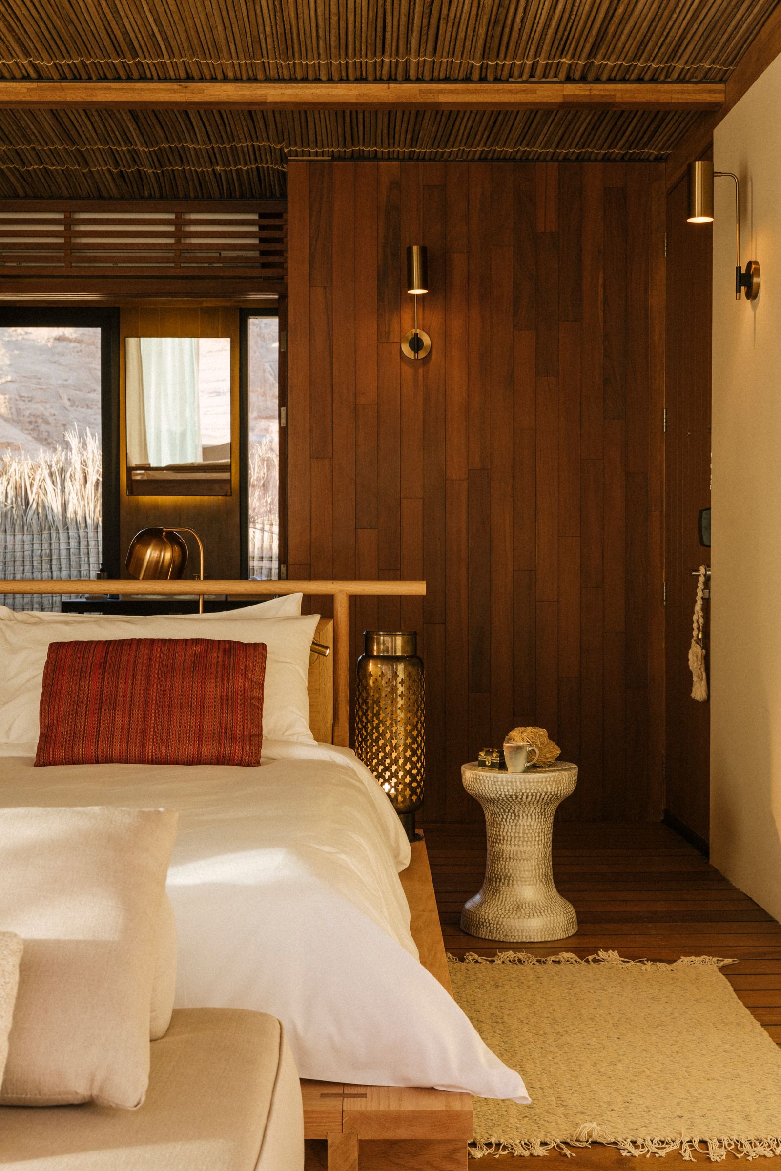 Image may contain Indoors Interior Design Wood Panels Hardwood Stained Wood Wood Bed and Furniture