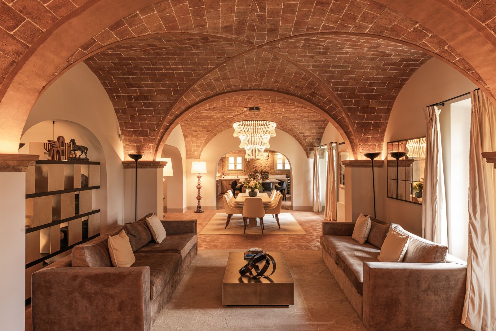 Image may contain Lamp Architecture Vault Ceiling Home Decor Rug Couch Furniture Indoors Building and Living Room