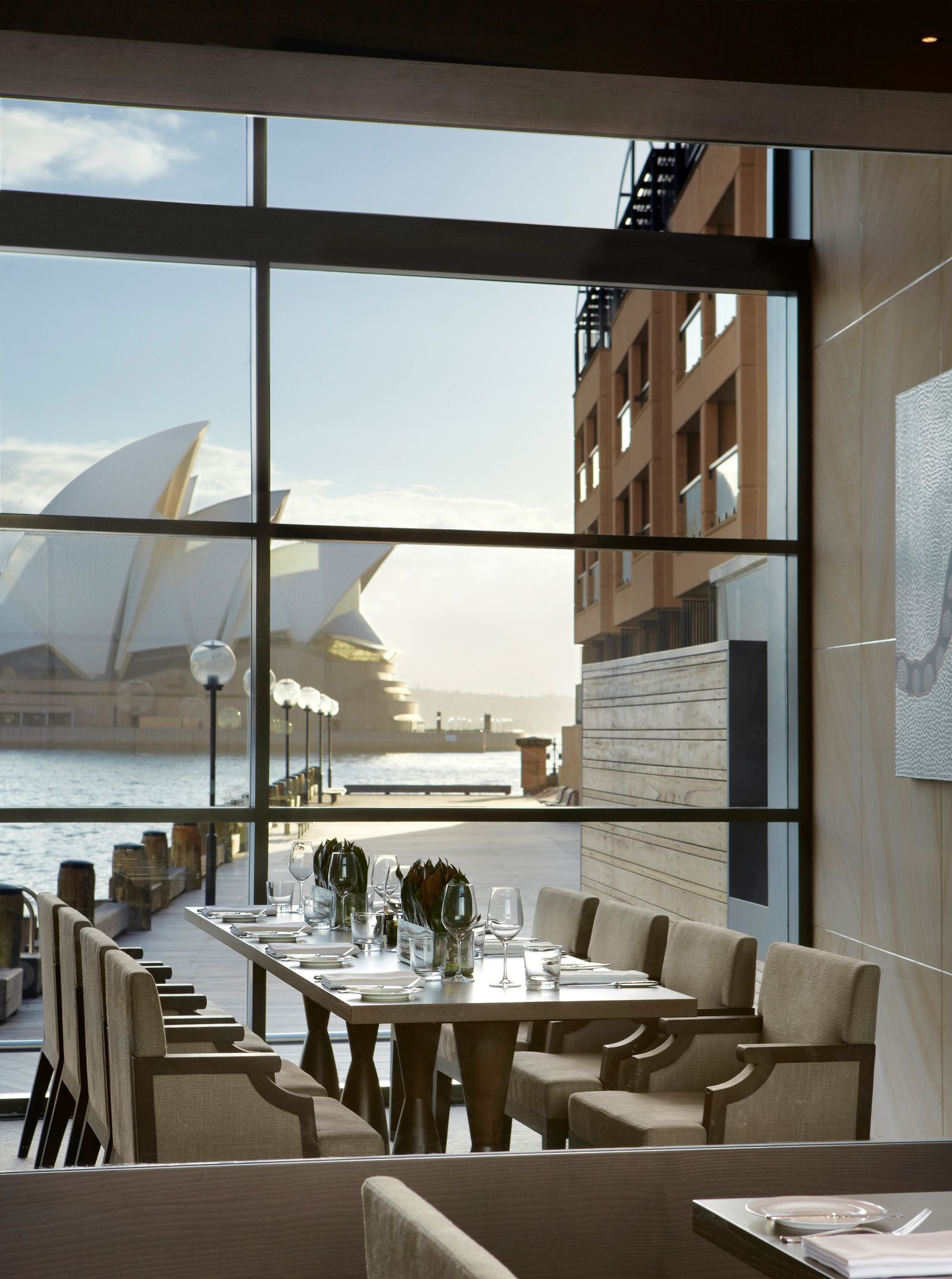 Image may contain Cup Chair Furniture Plate Cutlery Fork Landmark and Sydney Opera House