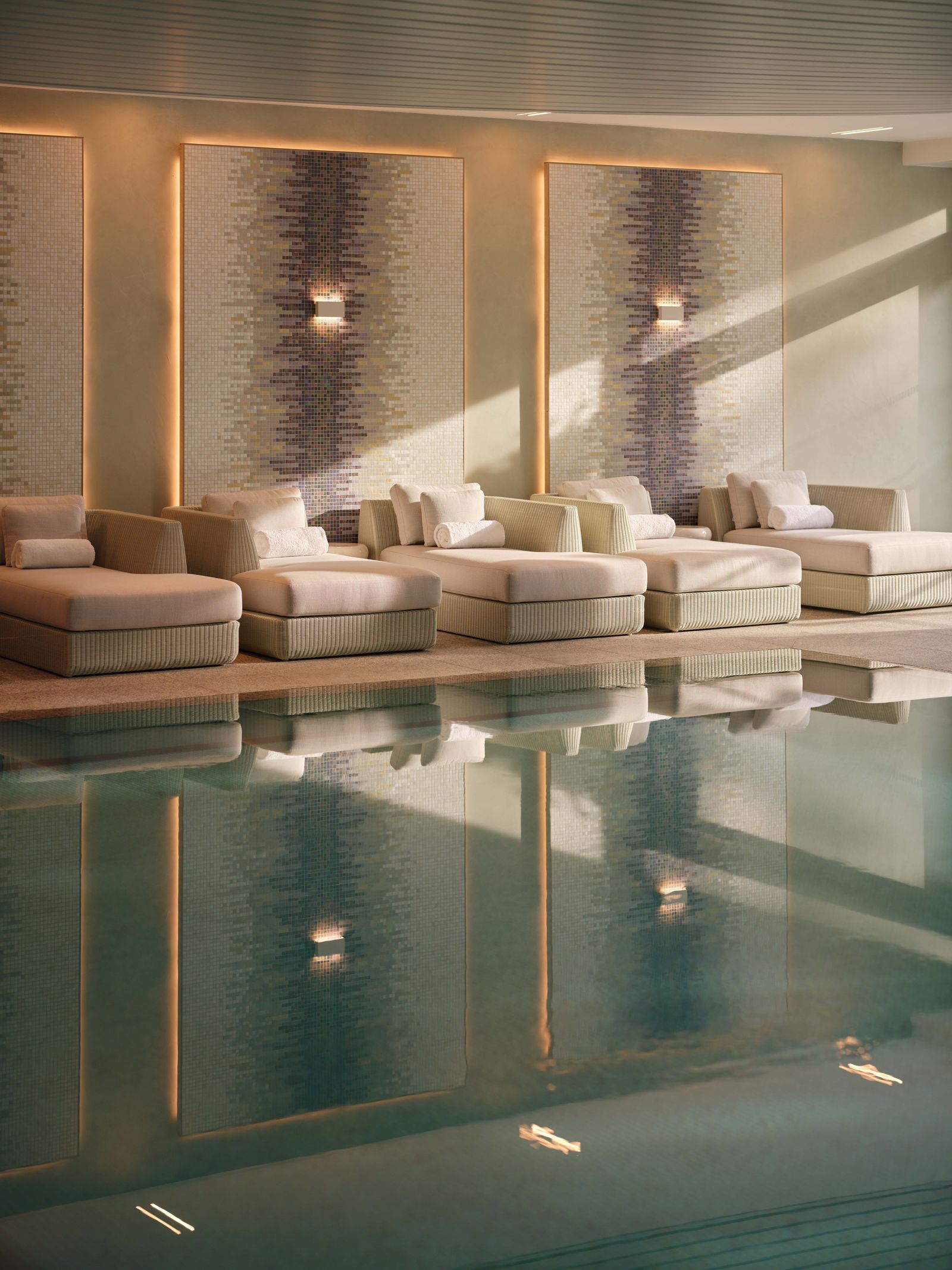 Image may contain Couch Furniture Indoors Interior Design Pool Water Swimming Pool Home Decor and Architecture