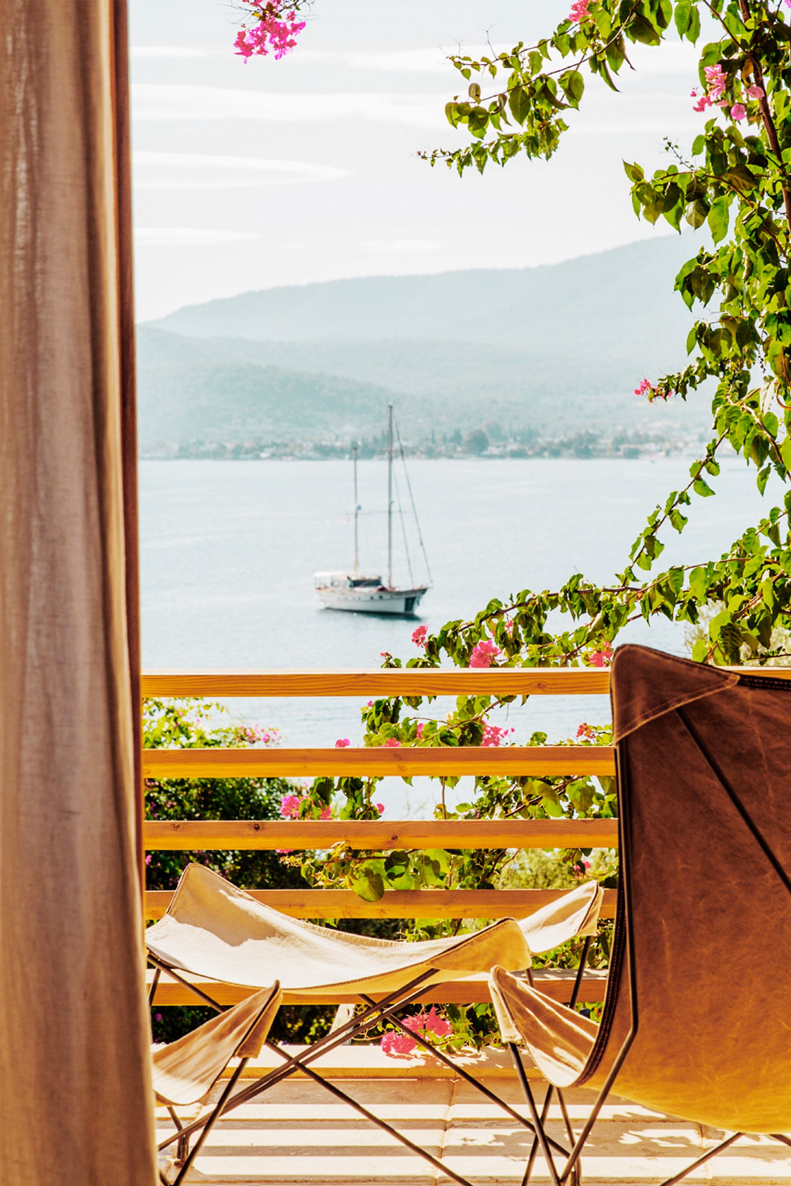 Image may contain Nature Outdoors Scenery Architecture Balcony Building Boat Sailboat Transportation and Vehicle