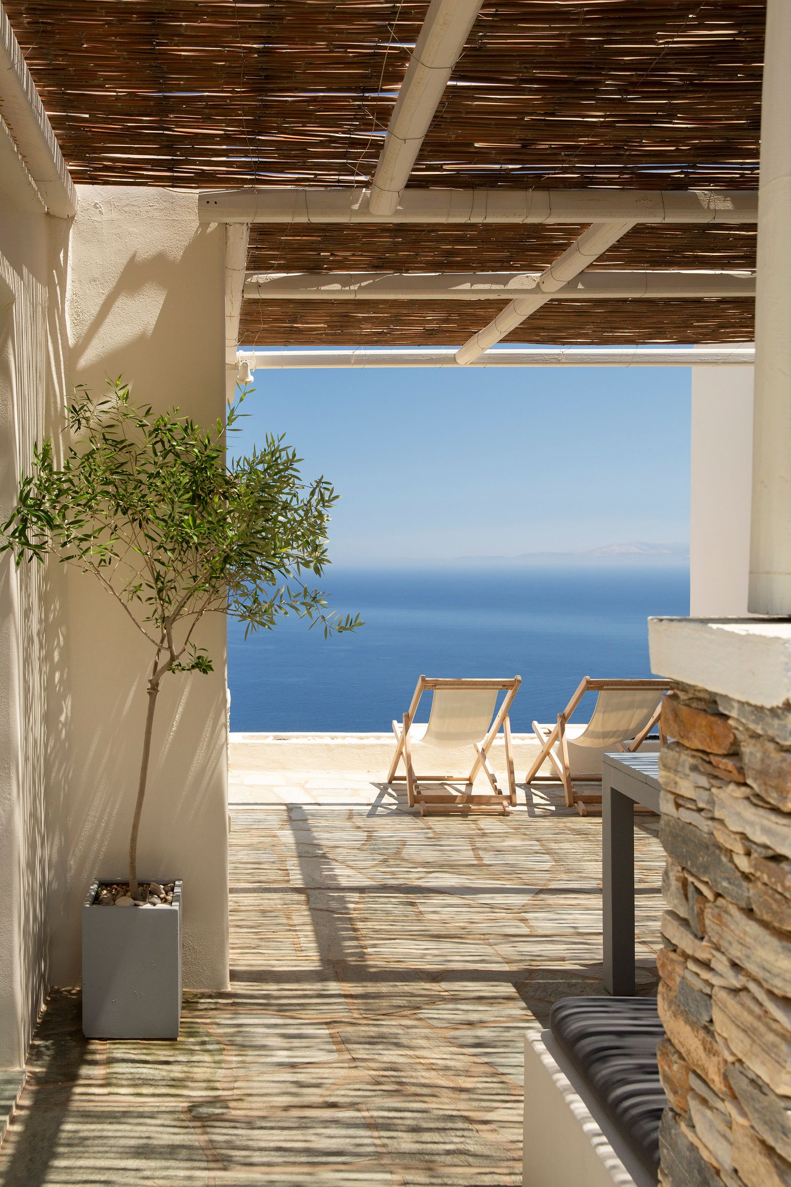 Image may contain Indoors Interior Design Chair Furniture Architecture Balcony Building Wood Nature and Outdoors