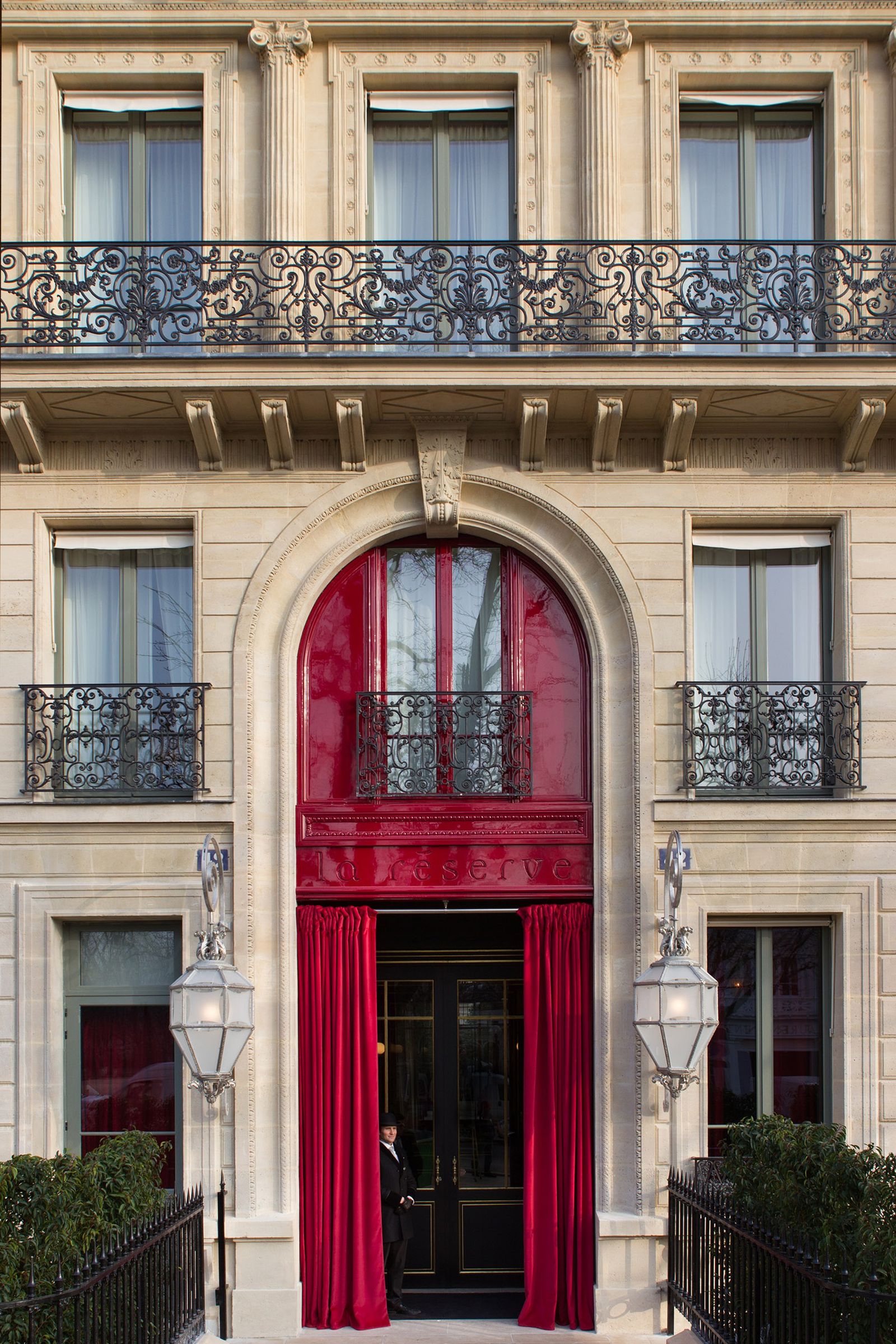 Image may contain Architecture Building Person Window French Window City and Arch