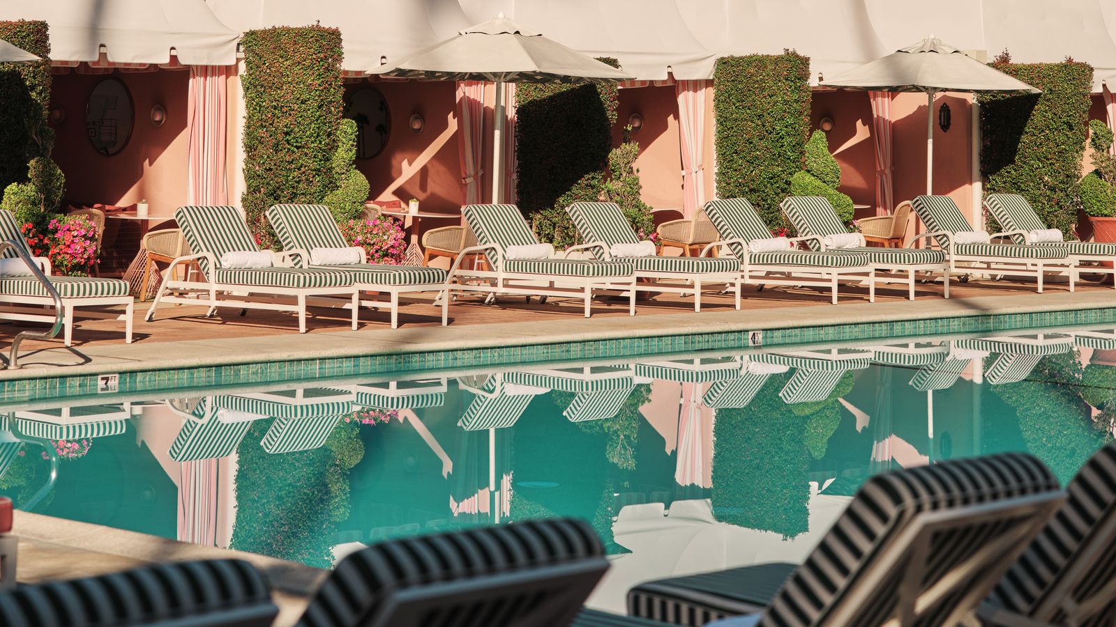 Image may contain Pool Water Swimming Pool Architecture Building Hotel Resort Chair Furniture and Outdoors