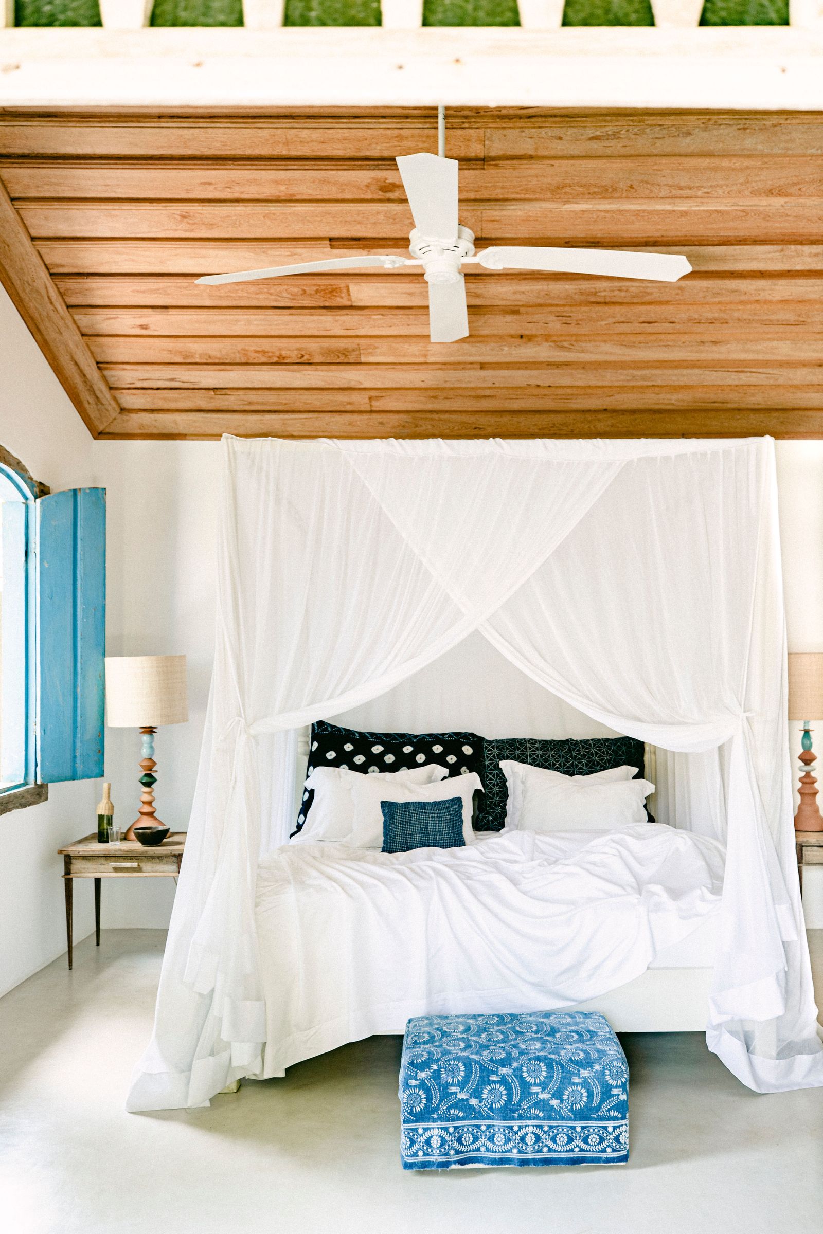 Image may contain Furniture Indoors Bed Bedroom Room Appliance Ceiling Fan Device Electrical Device and Canopy Bed