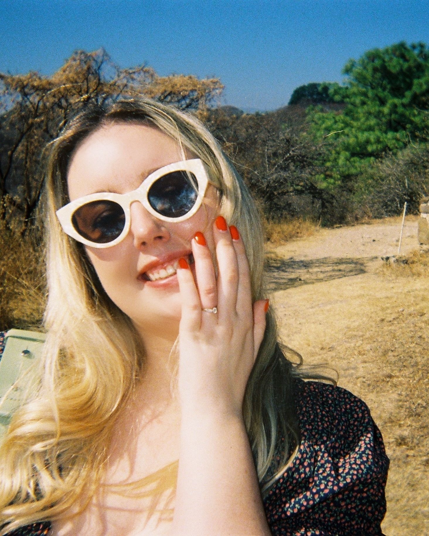 Image may contain Accessories Sunglasses Face Head Person Photography Portrait Glasses Plant Tree and Grass