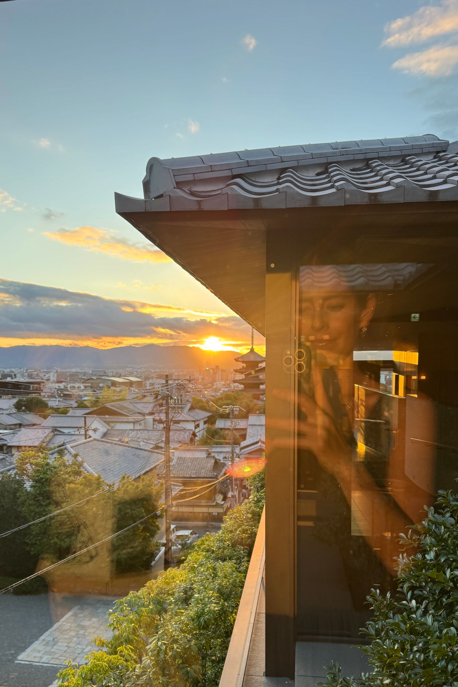 Image may contain Architecture Building Outdoors Shelter Nature Sky Urban Sunrise City Scenery Adult and Person