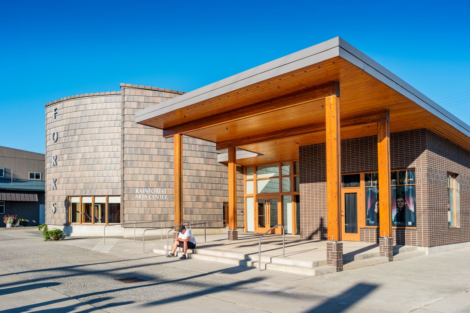 Image may contain Adult Person Architecture Building House Housing Portico Clothing Footwear and Shoe