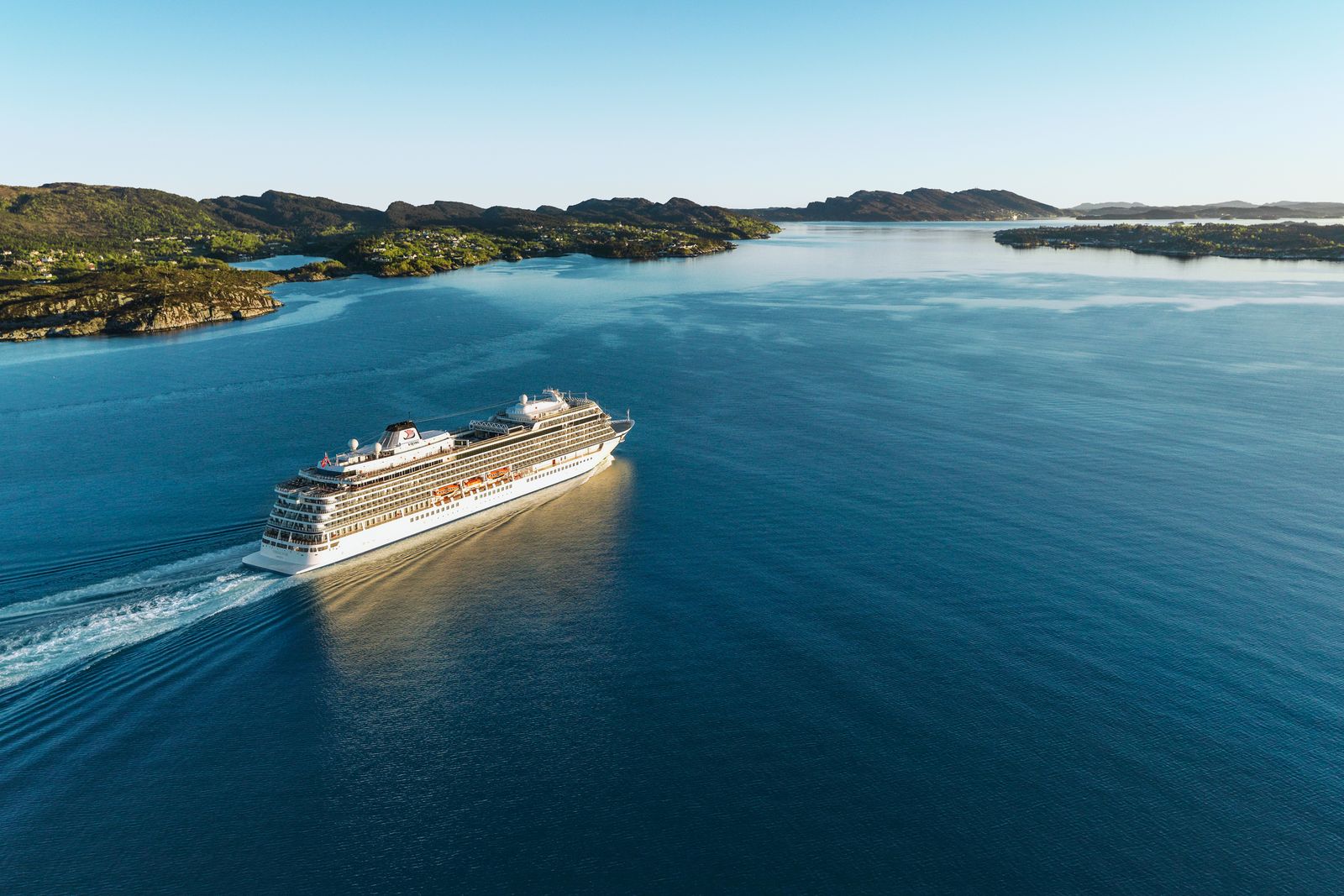 Image may contain Boat Transportation Vehicle Nature Outdoors Sea Water Cruise Ship Ship Land Coast and Shoreline