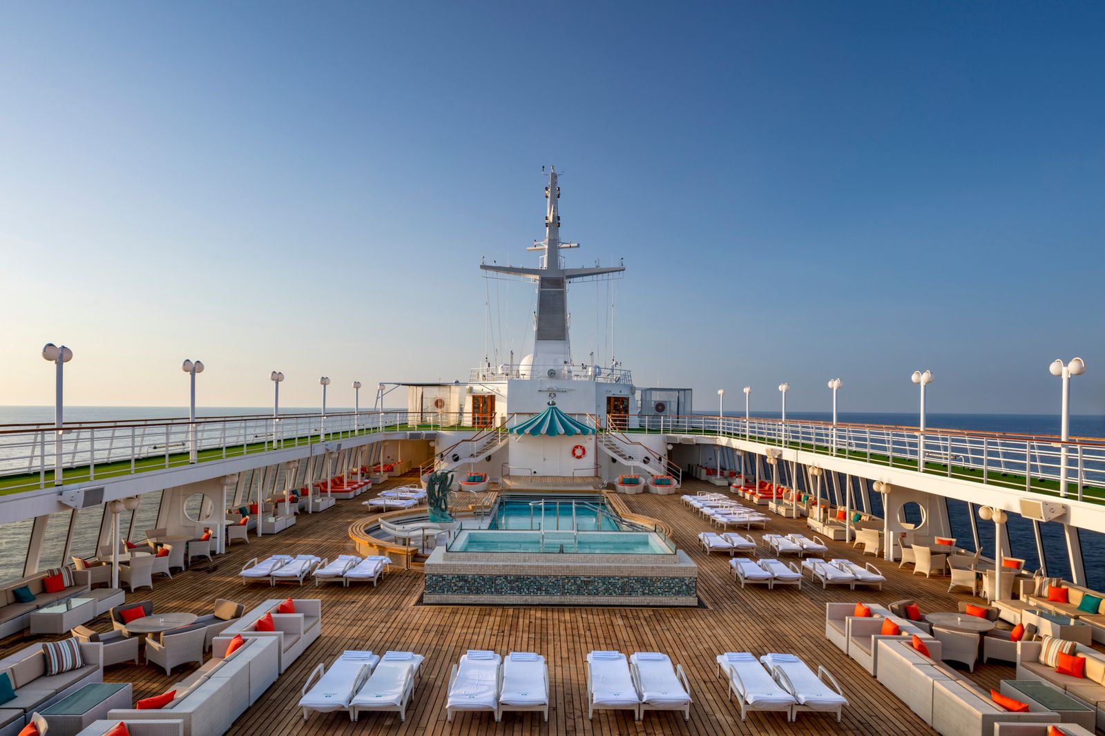 The Crystal Symphony's pool deck features one large pool a big hot tub and a stage for entertainment.
