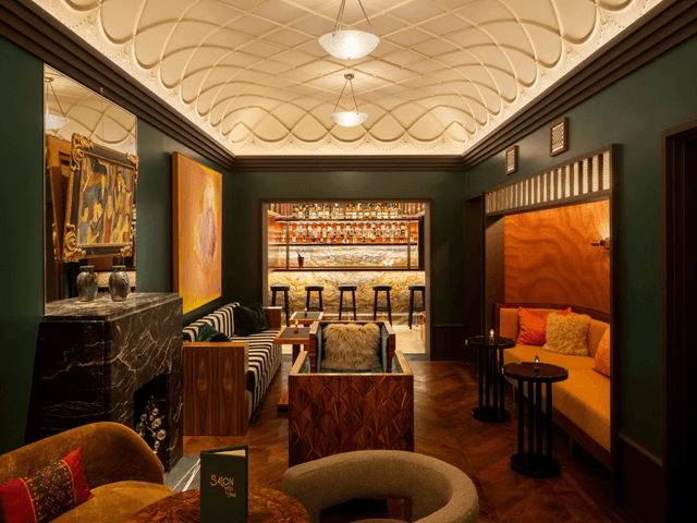 Image may contain: Architecture, Building, Furniture, Indoors, Living Room, Room, Chair, Home Decor, Interior Design, and Bar